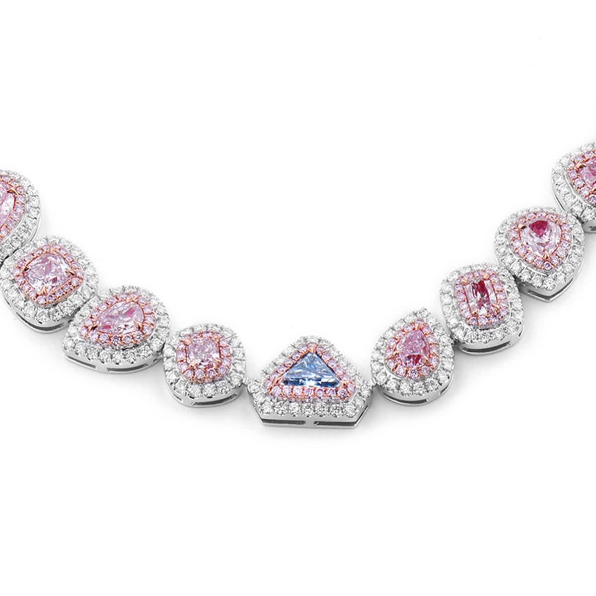 This Magnificent Piece is made from Natural, untreated Pink, White and Blue Diamonds. 
The majority of the Necklace is made up of Fancy Light Purplish Pink Diamonds. 
It hosts one blue diamond, blue diamonds being one of the rarest and most valuable