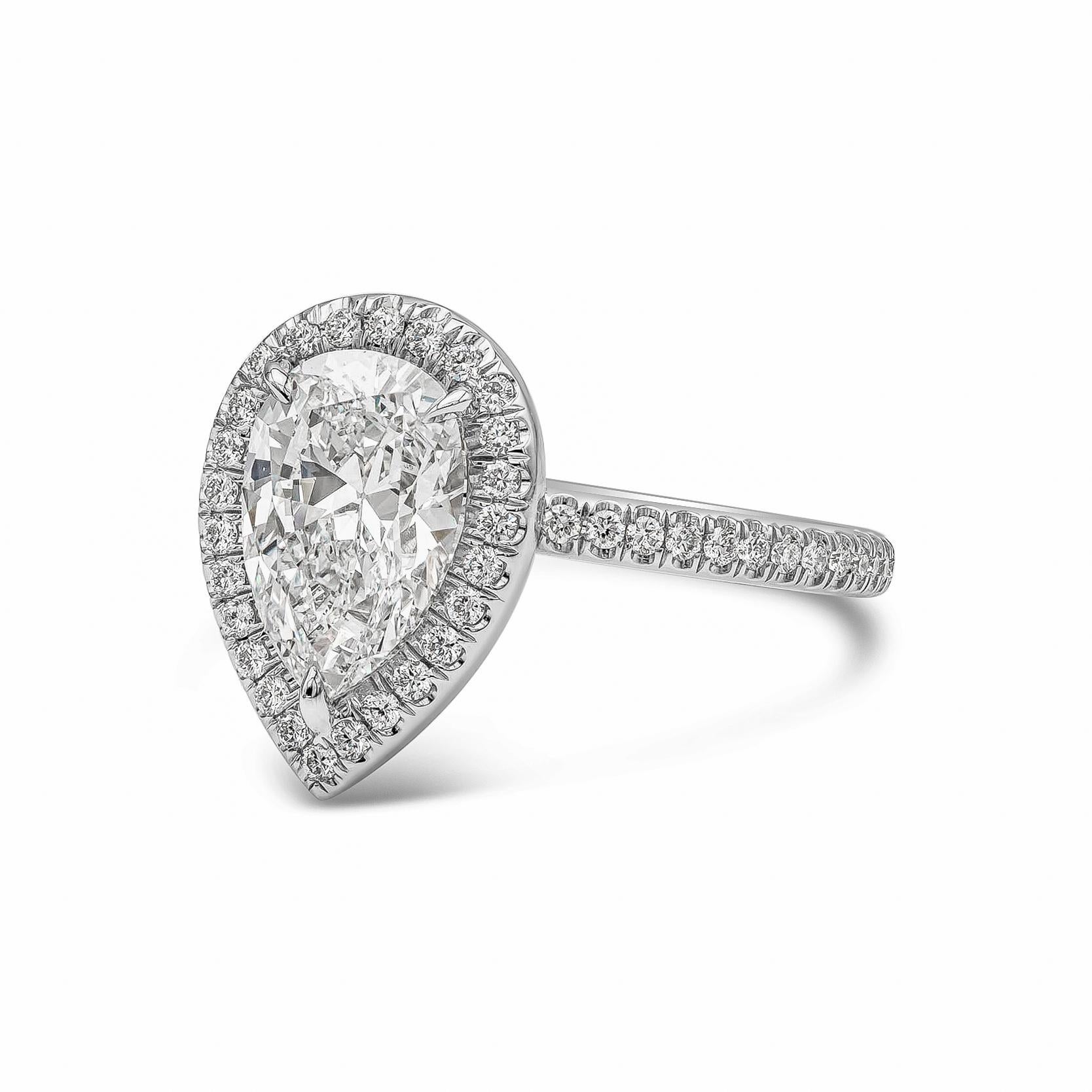A timeless engagement ring style showcasing a 1.89 carats elongated pear shape diamond certified by GIA Certified as G color and SI1 in clarity. Center stone is set in a halo brilliant diamond setting. Shank is finely made in polished platinum