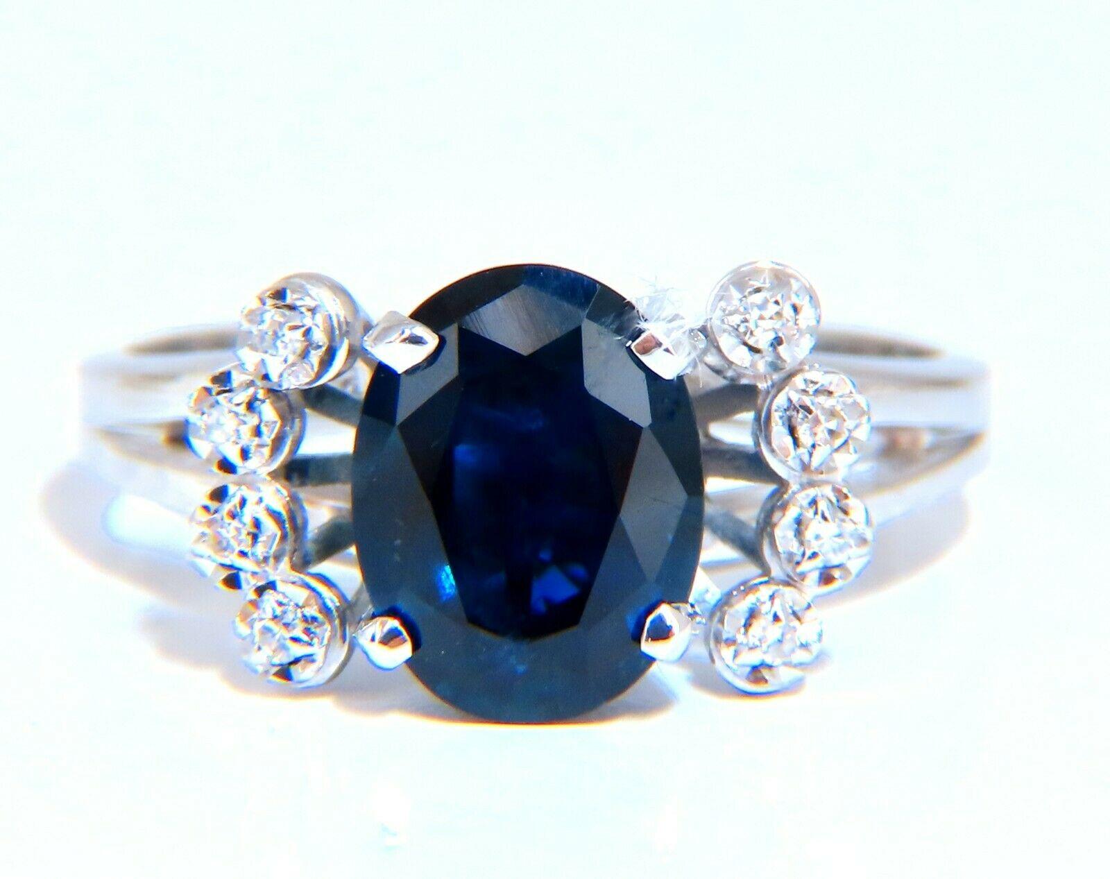 GIA Certified: 1.89ct.

Natural blue sapphire ring.

Full cut brilliant oval cut Clean clarity Transparent and vibrant

top Bright Gem Royal Blue

8.93 X 6.80 x 3.69mm

.12ct. Natural Diamonds Rounds, full cut H-color vs-2 clarity

14kt. White gold