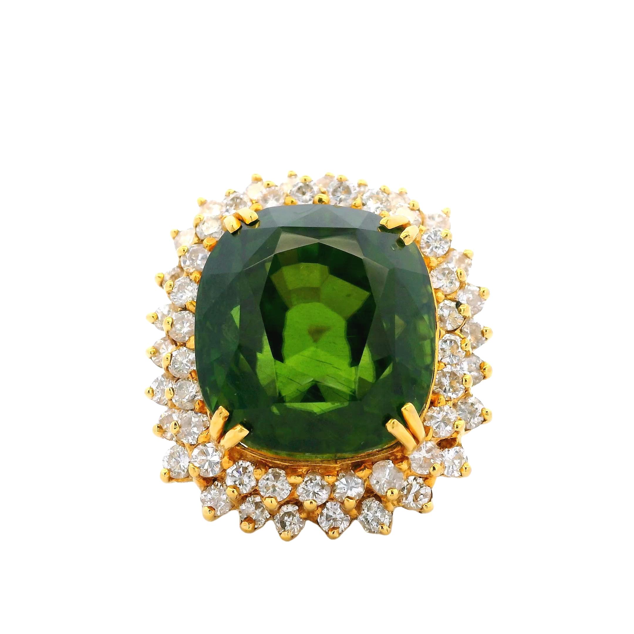 A breathtaking oversized Cocktail ring showcasing a rare and vibrant Peridot gemstone.
Expertly crafted in solid 18-karat polished yellow gold, this bold piece features a remarkable cushion step-cut Peridot (21.98 x 20.10 x 17.27 mm), weighing an