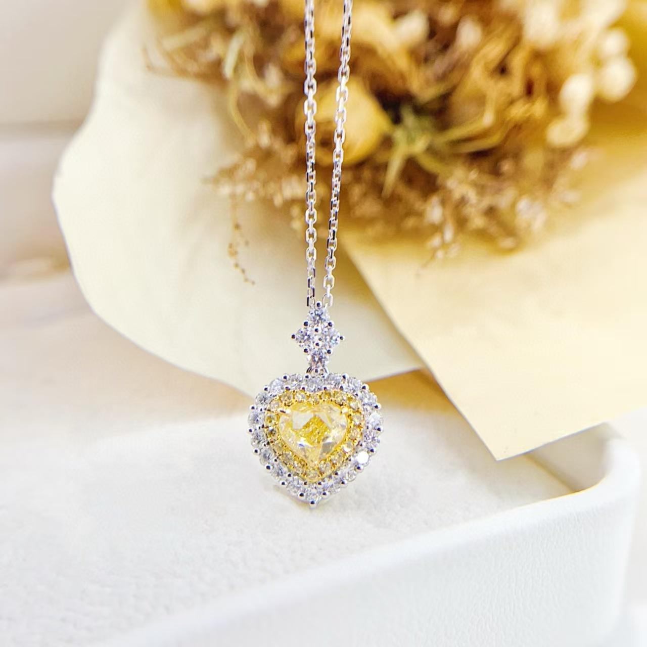 GIA Certified 18K Gold Heart Shaped Yellow Diamond Halo Set Necklace

Main stone  D - 1.01 CT
Side Stone D - 0.70 CT 
Total Weight - 3.73 GM

Certified Gemstone: The yellow diamond in this necklace is certified by GIA (Gemological Institute of