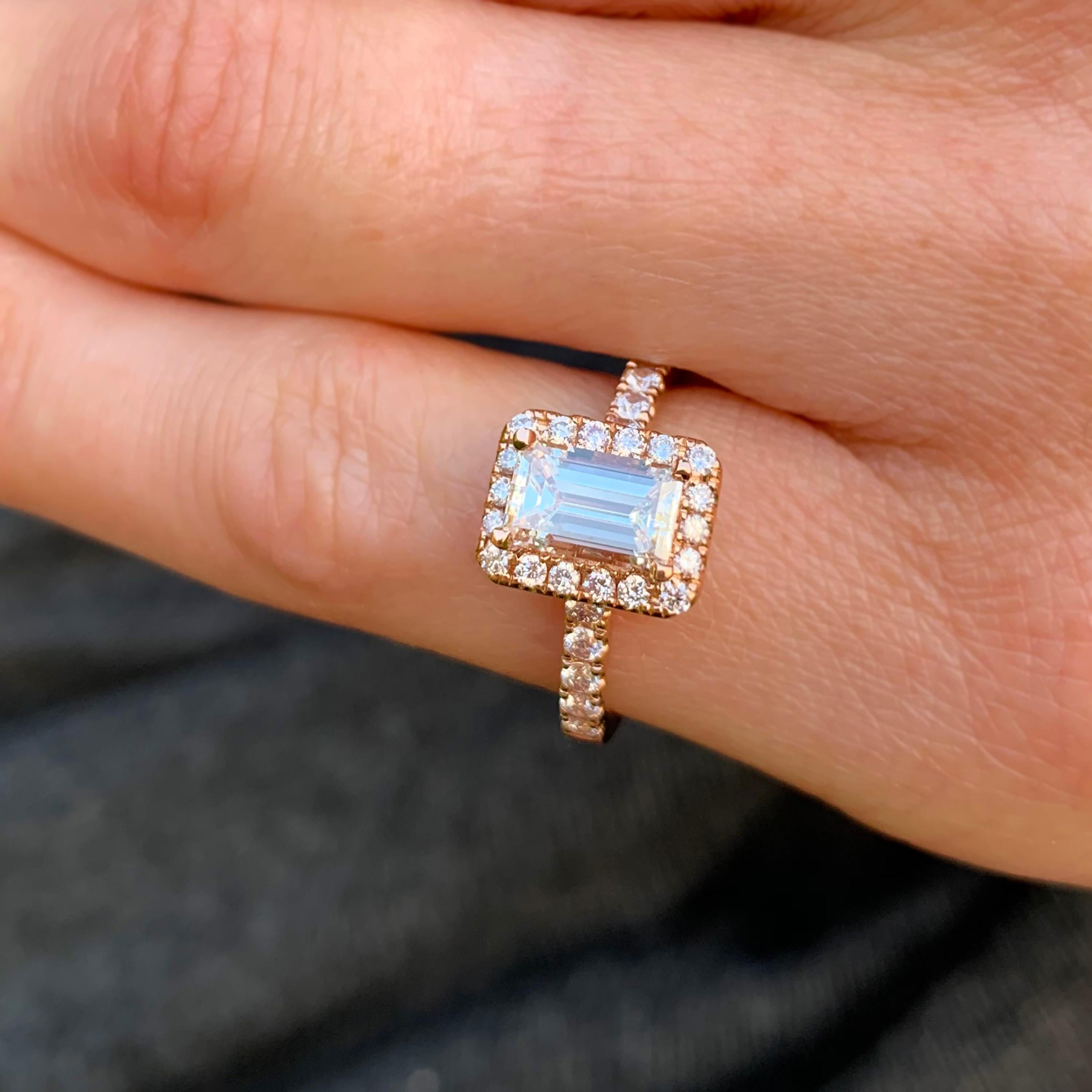 A classic but totally unique engagement ring by Ronan Campbell. Words do not do this piece justice. A breathtaking emerald cut diamond (0.90ct GIA F VS2) is surrounded by exquisitely matched pink diamonds (0.45ct) all wrapped up in warm rose
