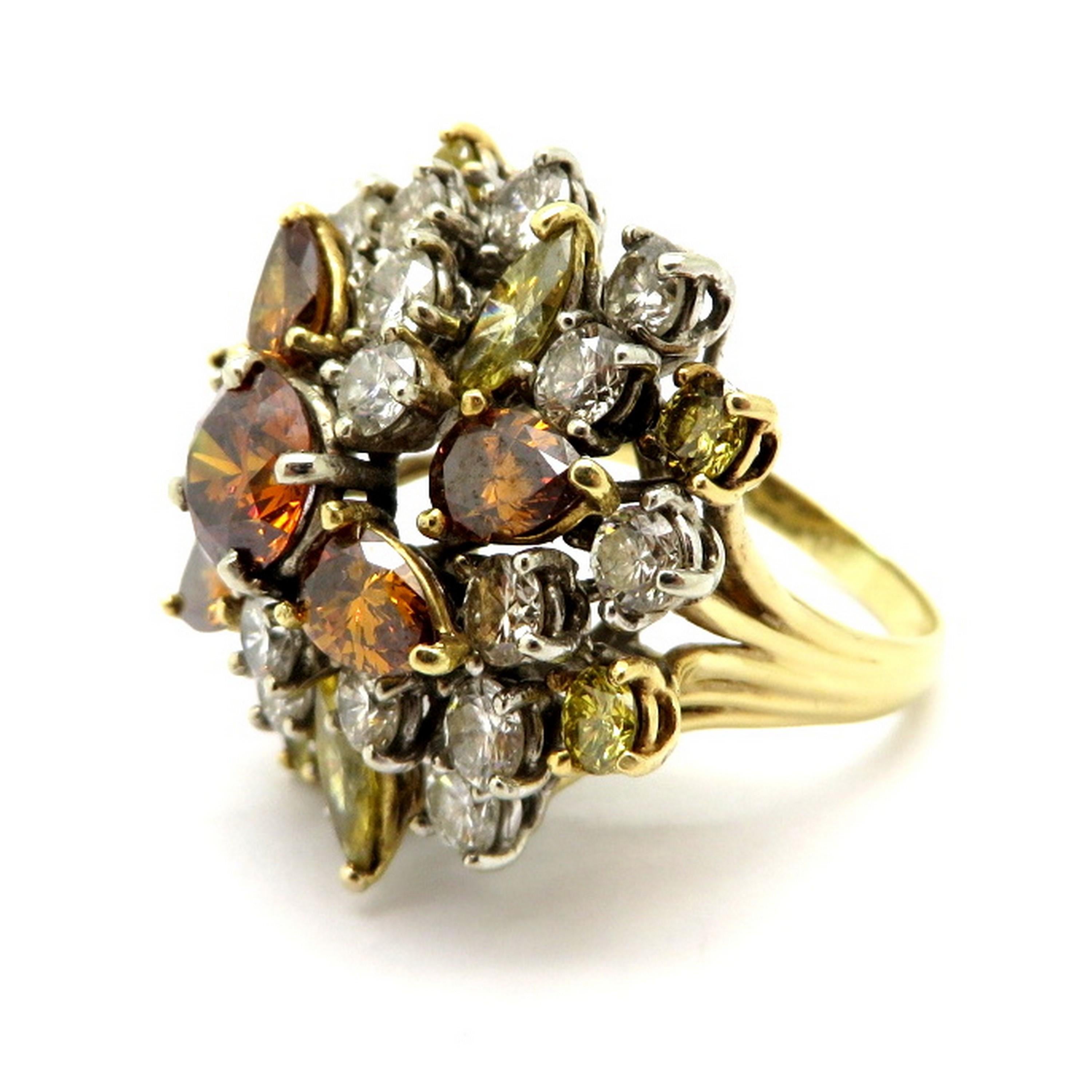 GIA certified 18K two-tone estate fancy brown and yellow diamond cluster cocktail ring. Showcasing one GIA certified fancy deep brownish orange round brilliant cut treated diamond weighing approximately 1.10 carats, having VS2 clarity. Accented with