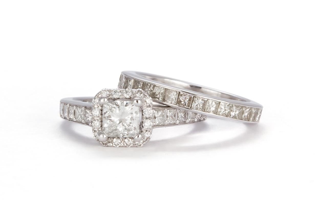 We are pleased to offer this GIA Certified 18k White Gold & Princess Diamond Halo Wedding Set 3.58ctw. This beautiful wedding set features an 18k white gold halo engagement ring set with a GIA certified & laser inscribed 0.60ct G/VS2 princess cut