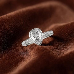 GIA Certified 1.90 Carats E VVS1 Pear Diamond Bezel Pavé Ring in 18K White Gold