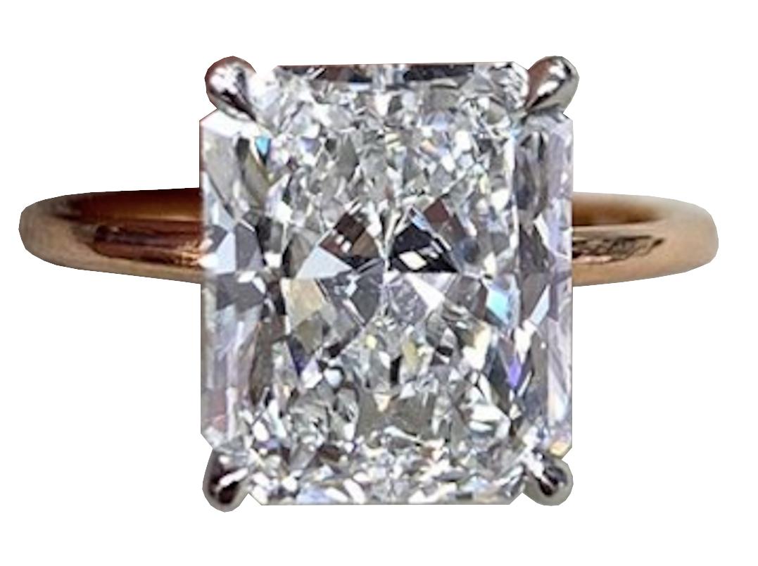 A beautiful GIA certified 1.52 Radiant Ideal Cut diamond ring consider the proportions of this stone are excellent and the stone actually looks bigger. The color is extremely white being an E from GIA is the best you can get and clarity is an VVS2