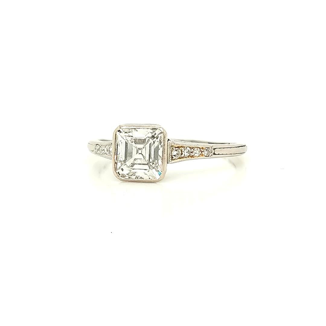 This breathtaking ring is from the early end of the Art Deco movement and carry all the elegance and beauty that characterized said movement. The ring is in platinum and features an almost otherworldly beautiful asscher cut diamond center. The