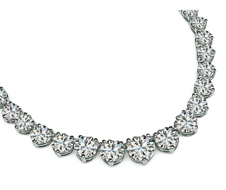 This is a gorgeous 18k white gold tennis necklace. The necklace is set with sparkling round cut diamonds that weigh approximately 19.18ct. The 7 center diamonds are GIA certified that weighs 1.09ct, 0.70ct, 0.66ct, 0.73ct, 0.70ct,0.51ct and 0.51ct.