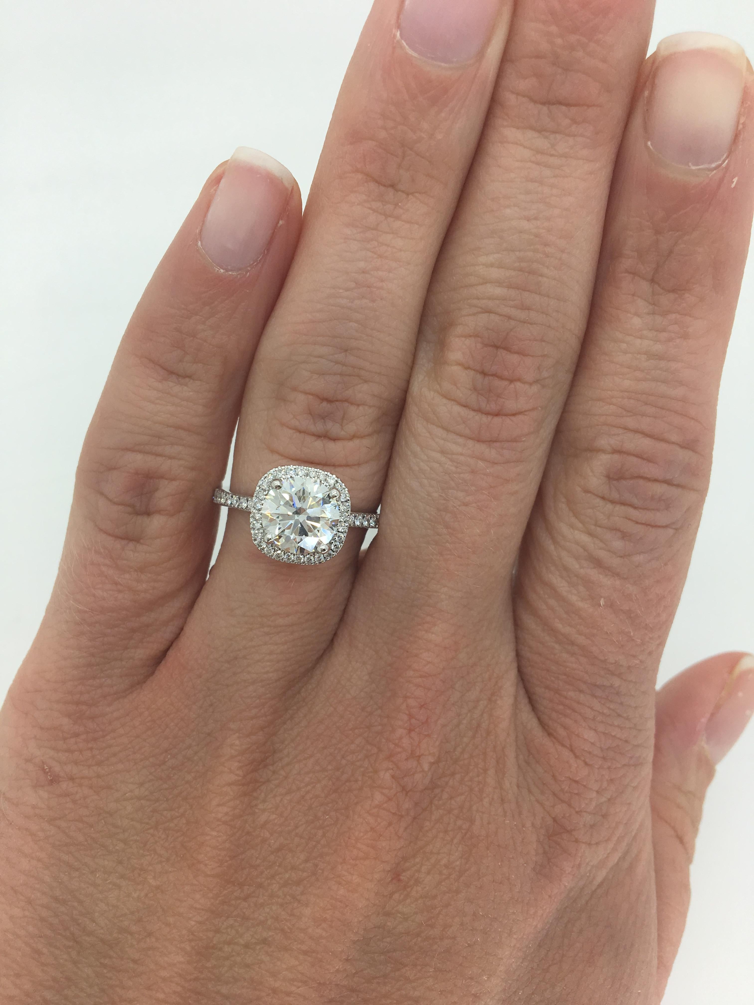 This GIA Certified Round Brilliant Cut Diamond is set in an elegant Simon G, 18k white gold halo style diamond ring.

GIA Certified: 5146933899 Electronic copy only
Center Diamond Carat Weight: 1.65CT
Center Diamond Cut: Round Brilliant
Center