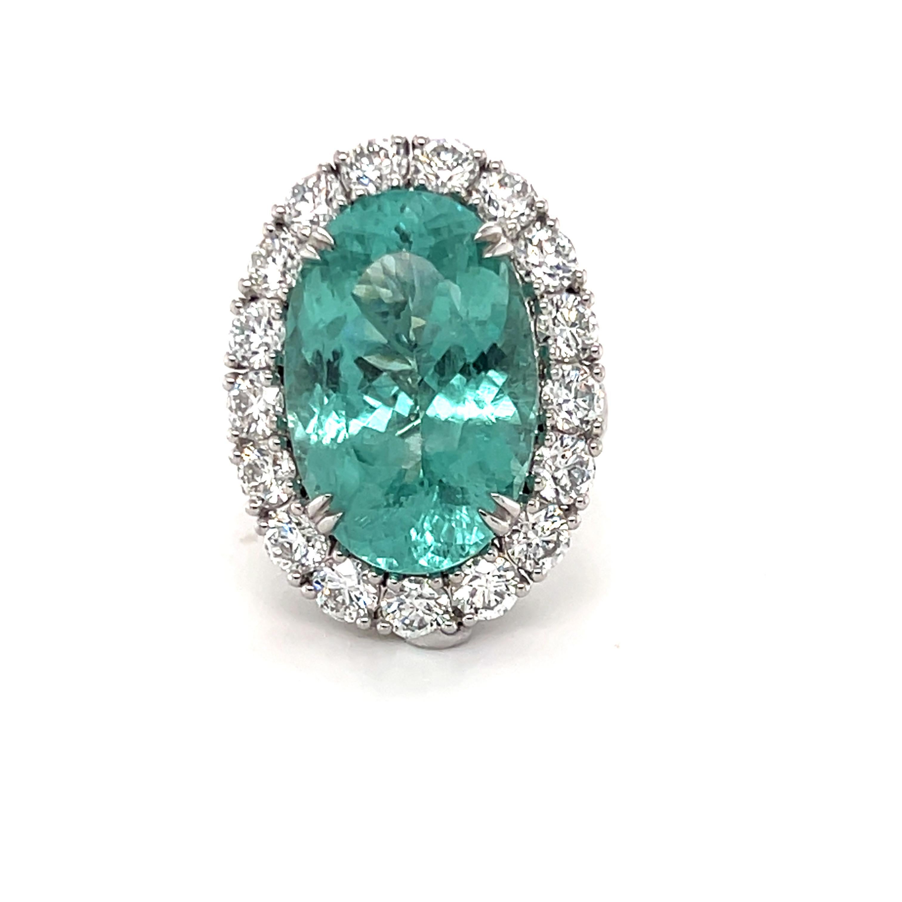 This stunning GIA-certified 19.86-carat Paraiba Tourmaline is framed by a halo of 4.16 carats of brilliant-cut diamonds. Meticulously crafted in platinum, this exquisite piece embodies timeless elegance and features a beautifully designed