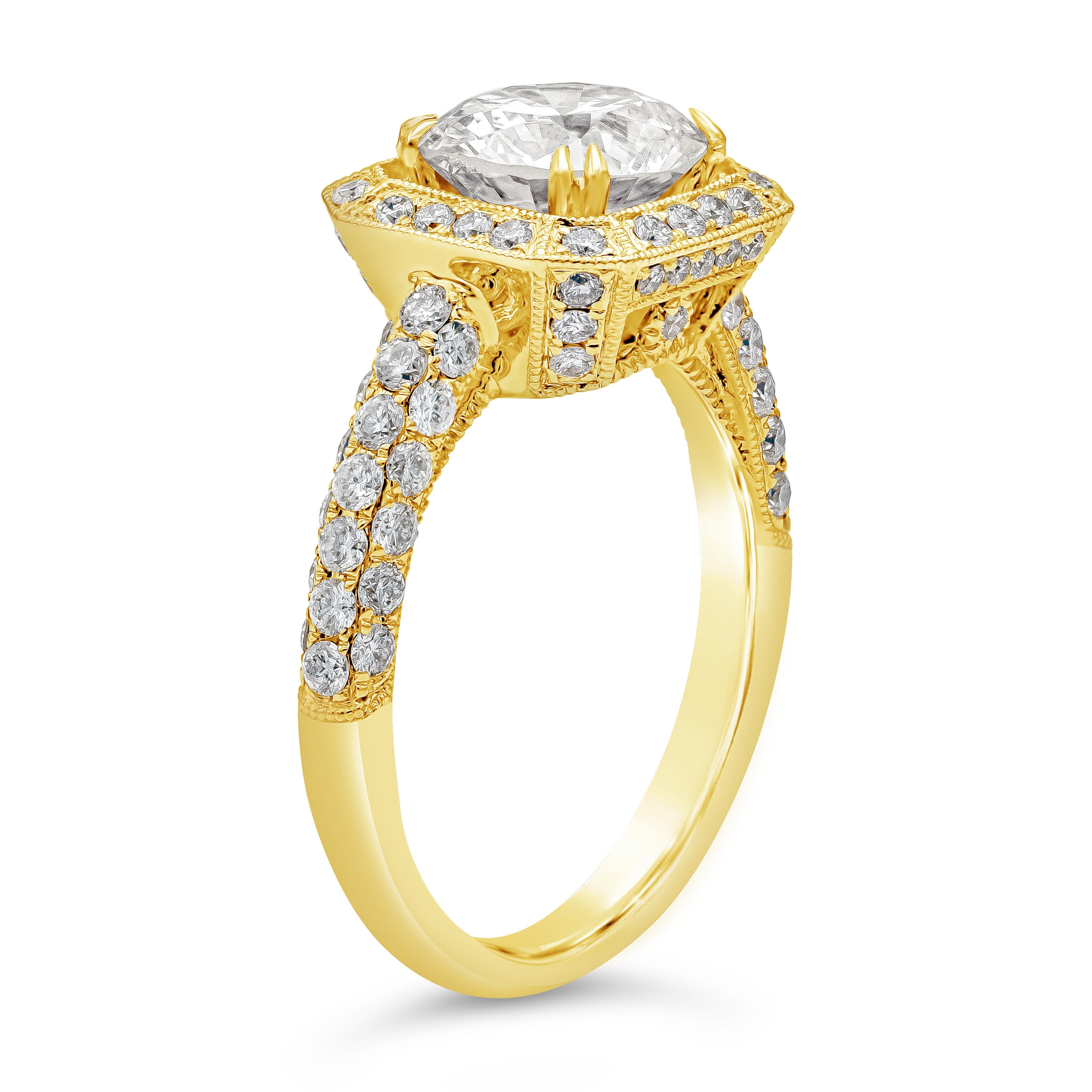 This gorgeous ring has a beautiful unique design set with a 1.99 carats brilliant round diamond certified by GIA as M color and VS2 in clarity. Surrounded by a single row of brilliant round diamonds that continue to the shank of the ring weighing
