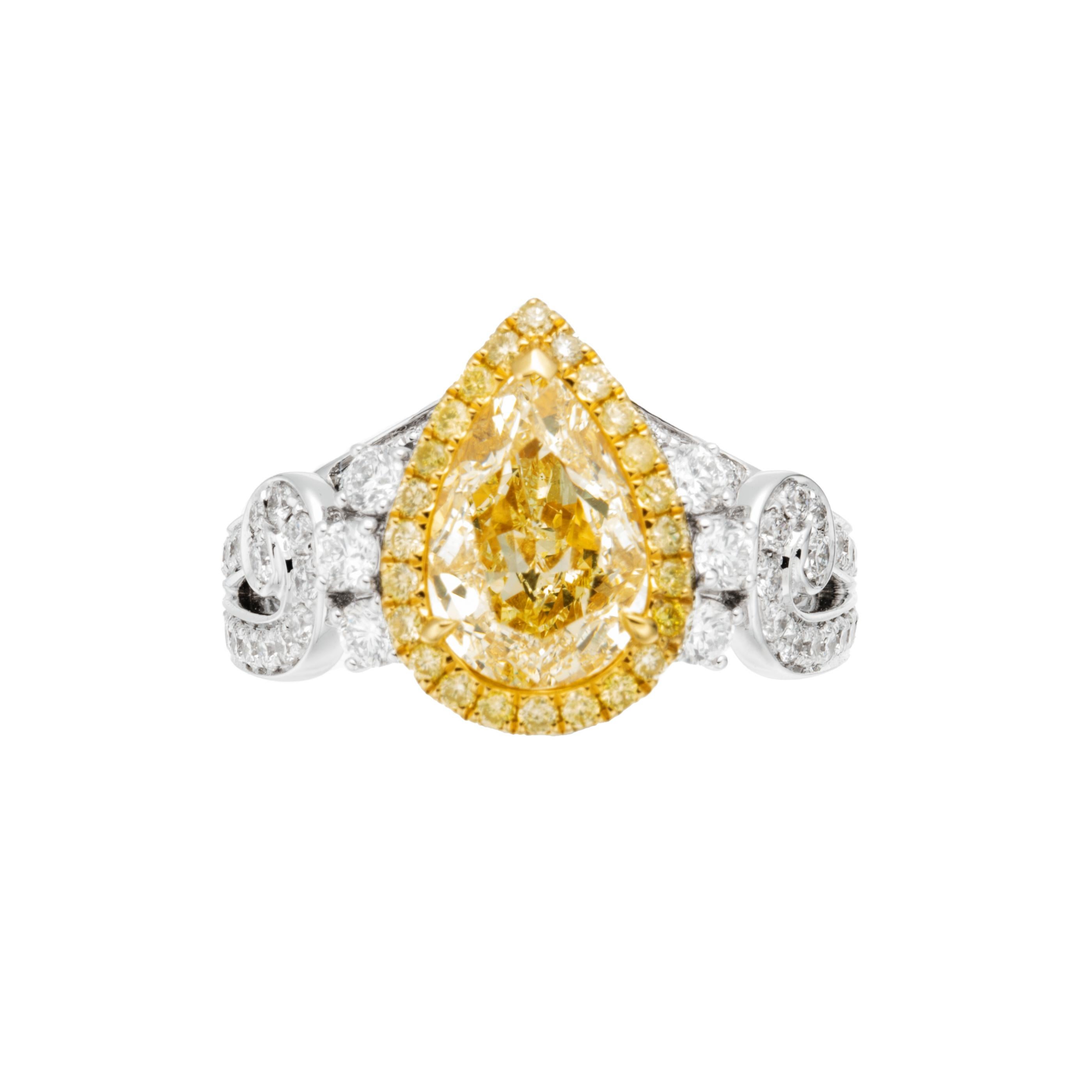 Introducing a truly captivating and classic masterpiece of jewelry, the 1.99ct Pear Shaped W-X Colour Yellow Diamond Solitaire Ring in exquisite 18KT gold. This ring is a radiant blend of timeless elegance and contemporary style, destined to make a