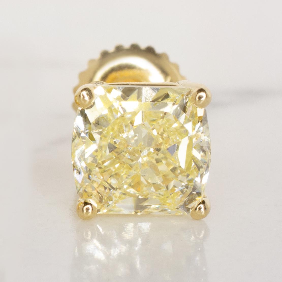 Contemporary GIA Certified 2 Carat Cushion Cut Fancy Yellow IF Diamond Studs Yellow Gold Ring For Sale