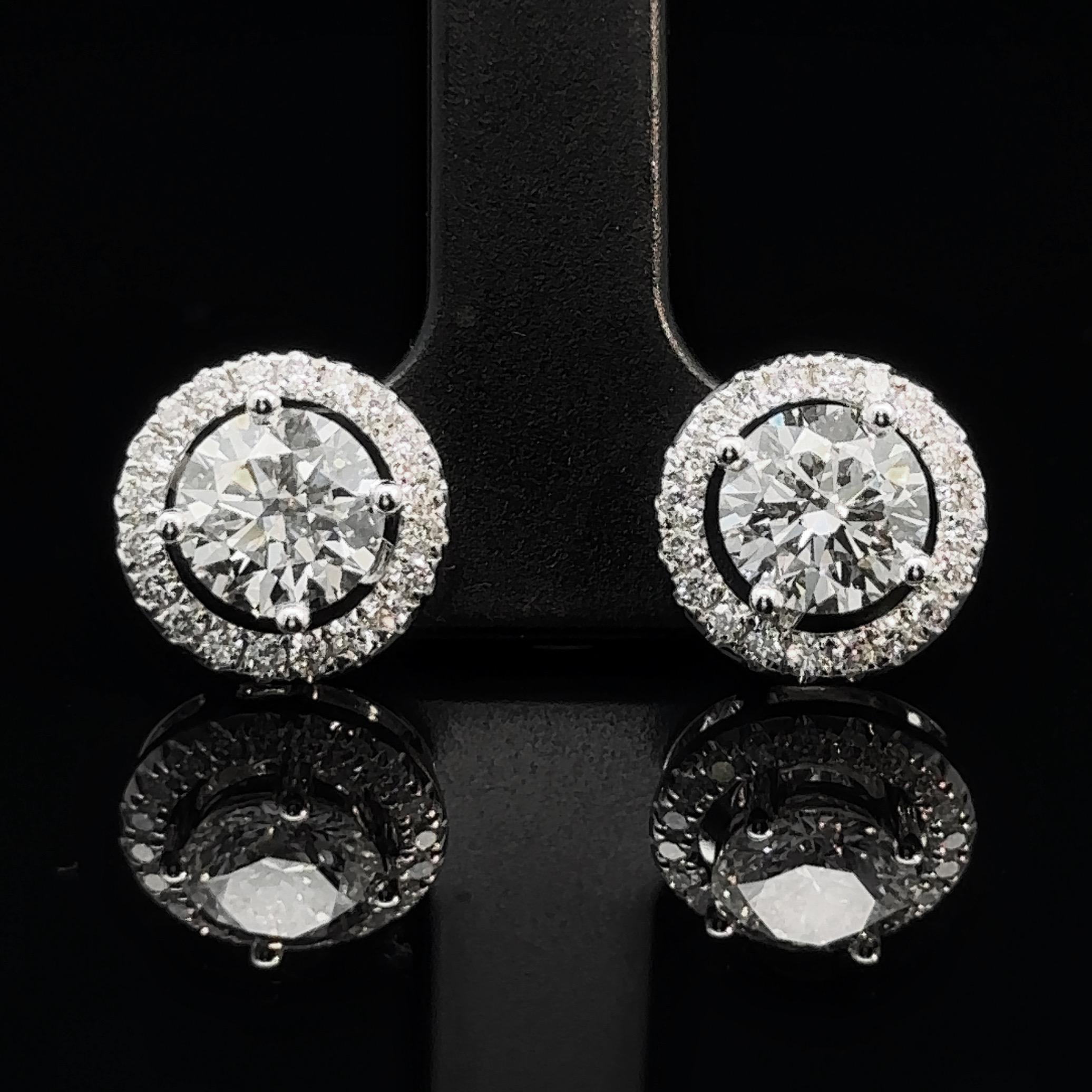 
Made to Order

introducing our exquisite GIA-certified 2 carats diamond halo 18k white gold stud earrings! Each earring features a brilliant 1 carat round-cut diamond, certified by the Gemological Institute of America (GIA), ensuring the highest