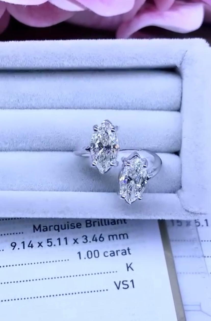 Stunning double diamonds ring, a very original design and style, so elegant and refined, by Italian designer.
Ring come in 18k gold with 2 natural diamonds, in marquise cut , of 1 carat + 1 carat , total 2 carats,
 K color and VS1-VS2