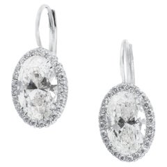 GIA-Certified 2 carat each Oval Shaped Diamond Earrings in Platinum