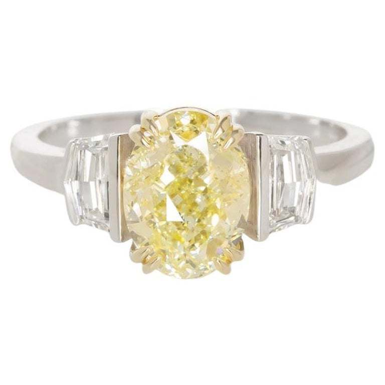 GIA Certified 2 Carat Fancy Yellow Oval Diamond Three Stone Ring For