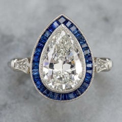 GIA Certified 2 Carat Pear Cut Diamond and Sapphire Halo Ring