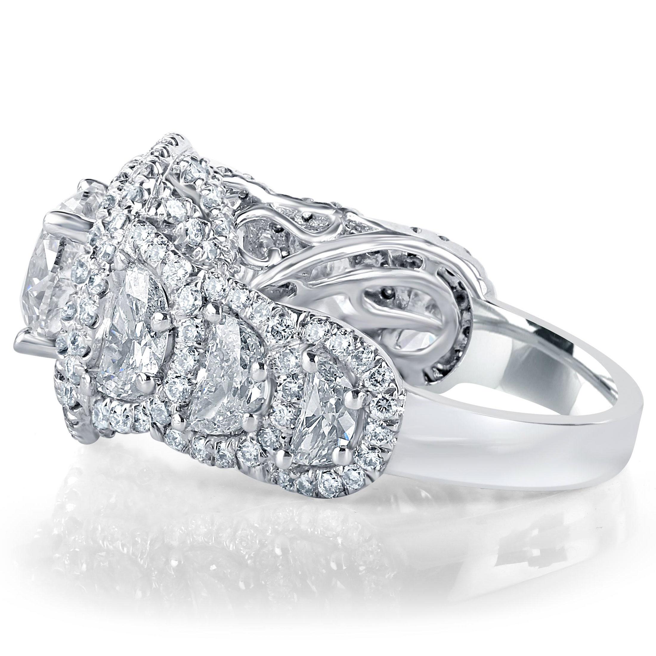 This magnificent engagement ring features a breathtaking 2-carat GIA Certified round-cut diamond, graded H color and SI1 clarity. The central diamond is elegantly showcased within a dazzling double halo of round brilliant diamonds, meticulously set