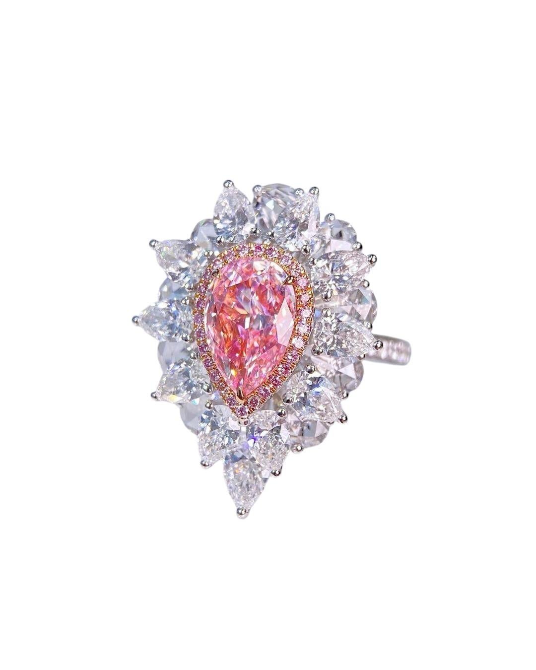 This magnificent cocktail ring is set with a 2 carat Very Light Pink type IIa pear cut diamond surrounded by a pink diamond halo, enhanced by pear and round cut side diamonds. 

New ring 
Main diamonds: 
• Very Light Pink 2ct VVS1 GIA 

Side