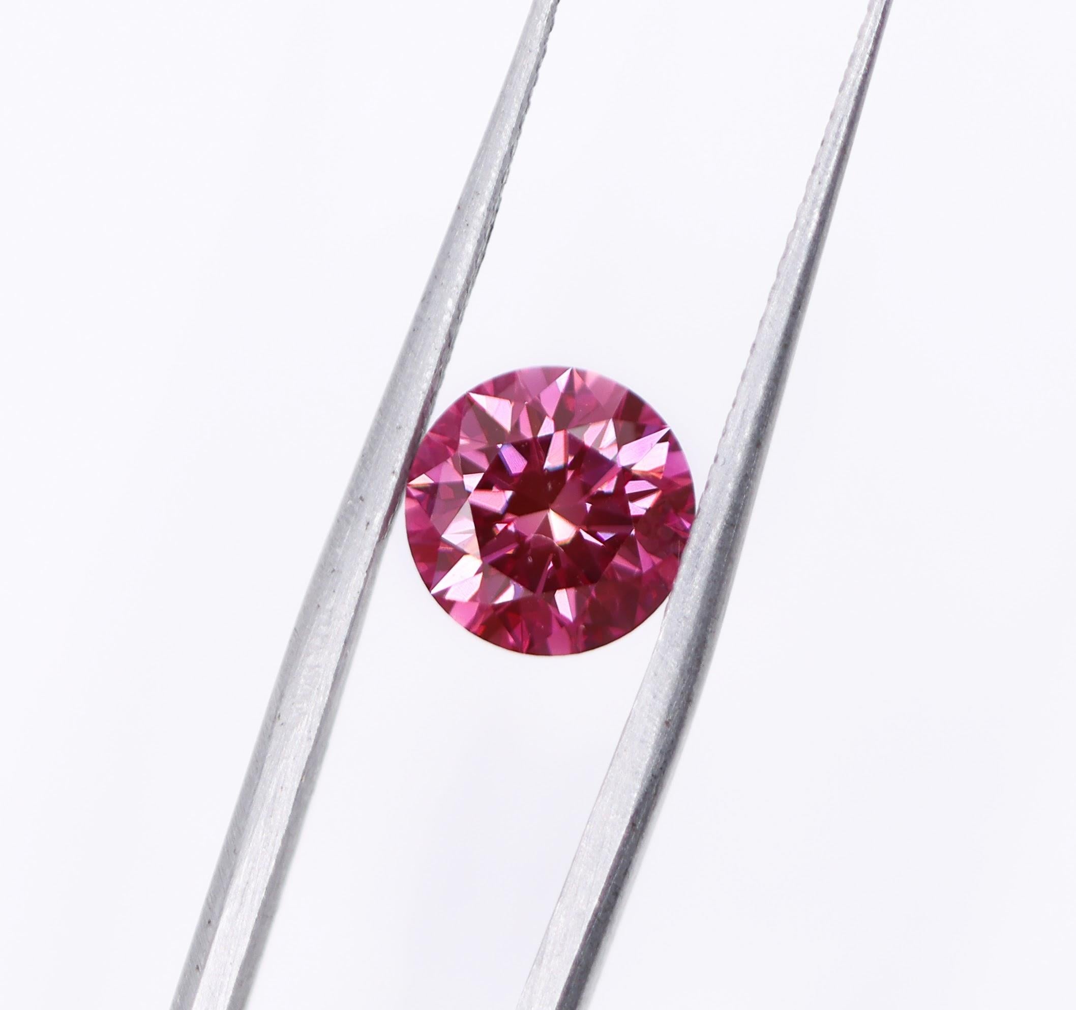 We are thrilled to bring you this absolutely gorgeous pink natural earth mined diamond! This diamond is HPHT treated, giving it a stunning purplish pink color. A fabulous size for an engagement ring or statement piece that is sure to turn heads.