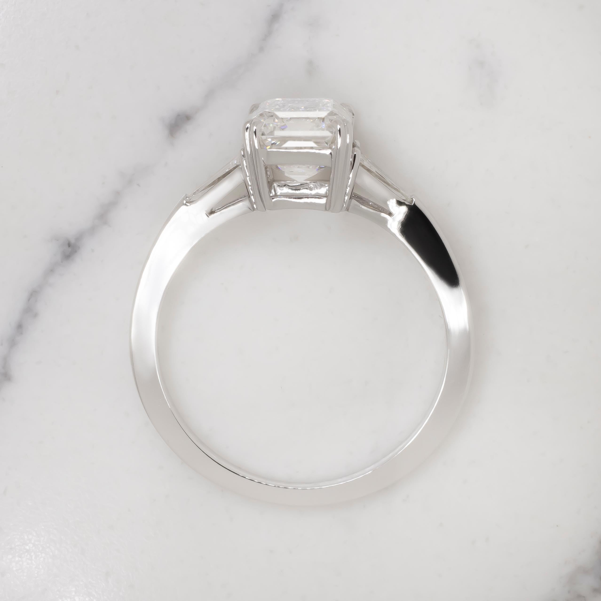 Elevate your style with this exquisite GIA Certified 2.00 Carat Emerald Cut Diamond 18K White Gold Ring. At the heart of this stunning piece lies a mesmerizing 2.00 carat emerald cut diamond, certified by the Gemological Institute of America (GIA)