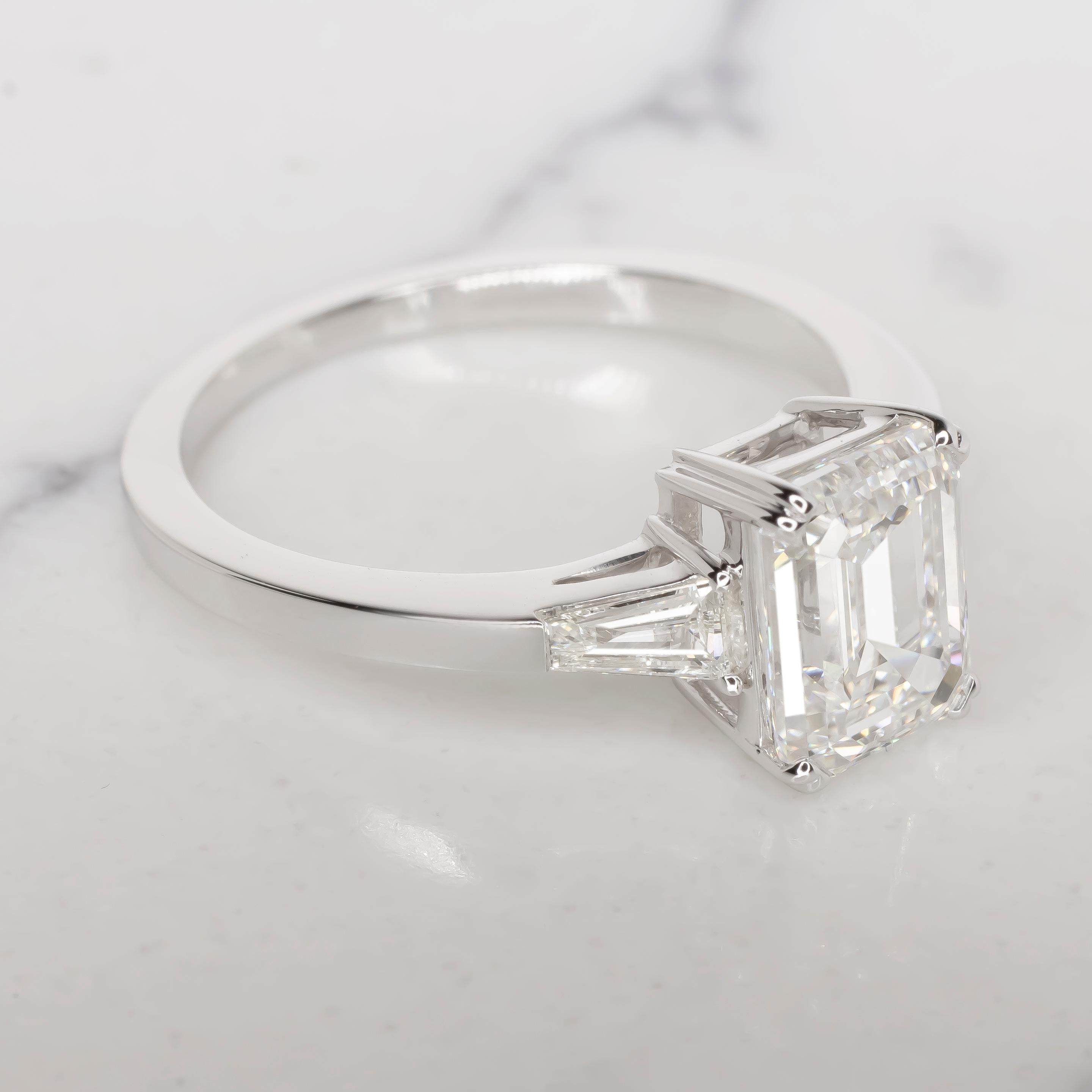Contemporary GIA Certified 2.00 Carat Emerald Cut Diamond 18K White Gold Ring For Sale