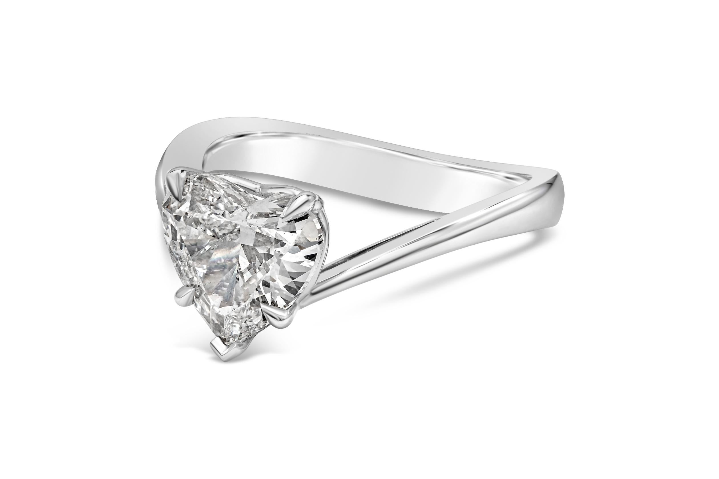 A well crafted engagement ring showcasing a 2.00 carats total heart shape diamond set in a chic contoured band and made in platinum. GIA Certified heart shape diamond is classified as F color and SI2 in clarity. Size 6.25 US and resizable upon