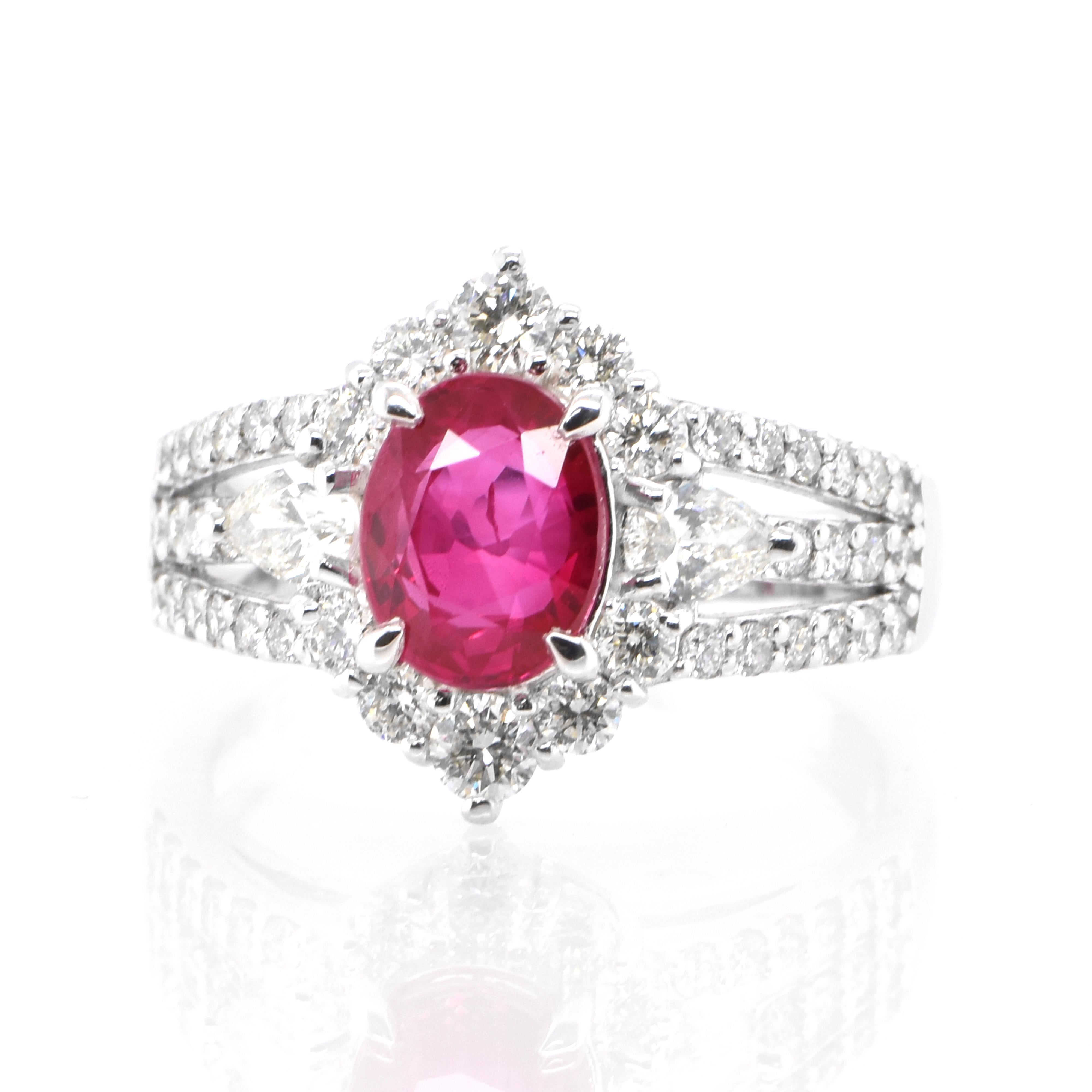 A beautiful ring set in Platinum featuring a GIA Certified 2.00 Carat Natural Burmese Ruby and 1.04 Carat Diamonds. Rubies are referred to as 