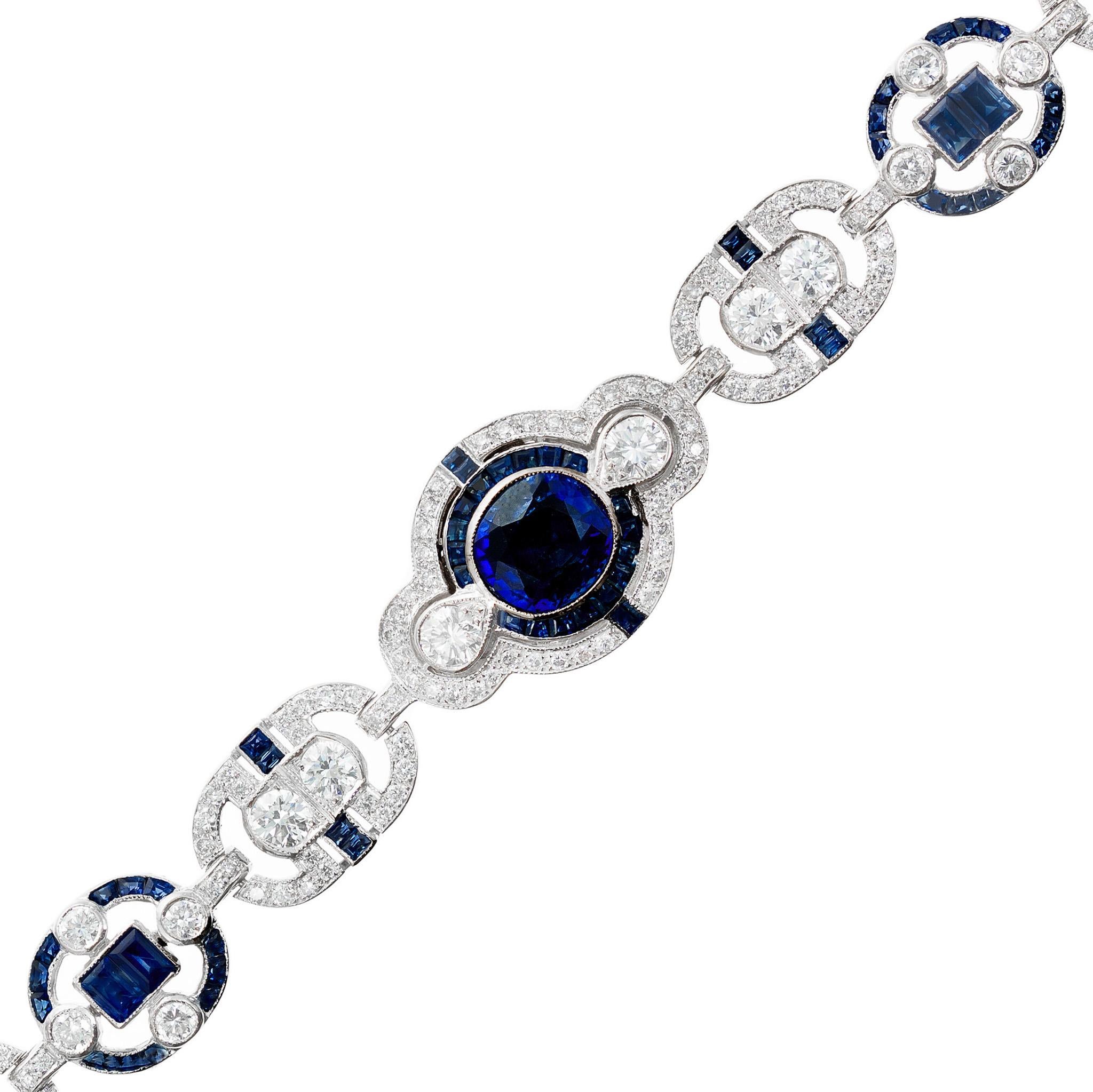 Absolutely stunning GIA Certified sapphire and diamond bracelet. This bracelet begins with a GIA certified, simple heat only, 2.00ct oval sapphire at the center and is accented by halos of baguette sapphires and round diamonds. A staggering 330