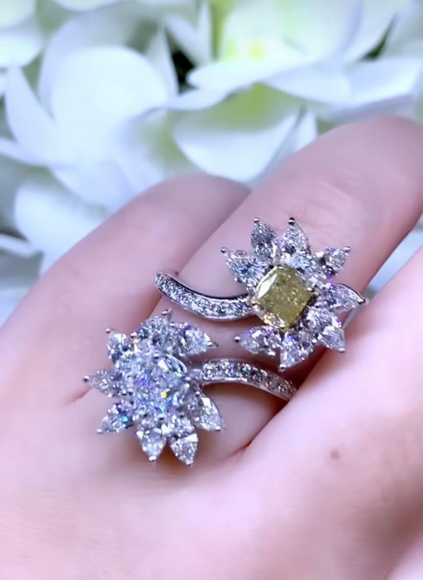A gorgeous ring in flowers design, so adorable, impressive , a very particular and sophisticated style, by Italian designer. A true piece of art.
Flowers ring come in 18k gold with  two central flowers GIA certified natural fancy diamond of 1,00