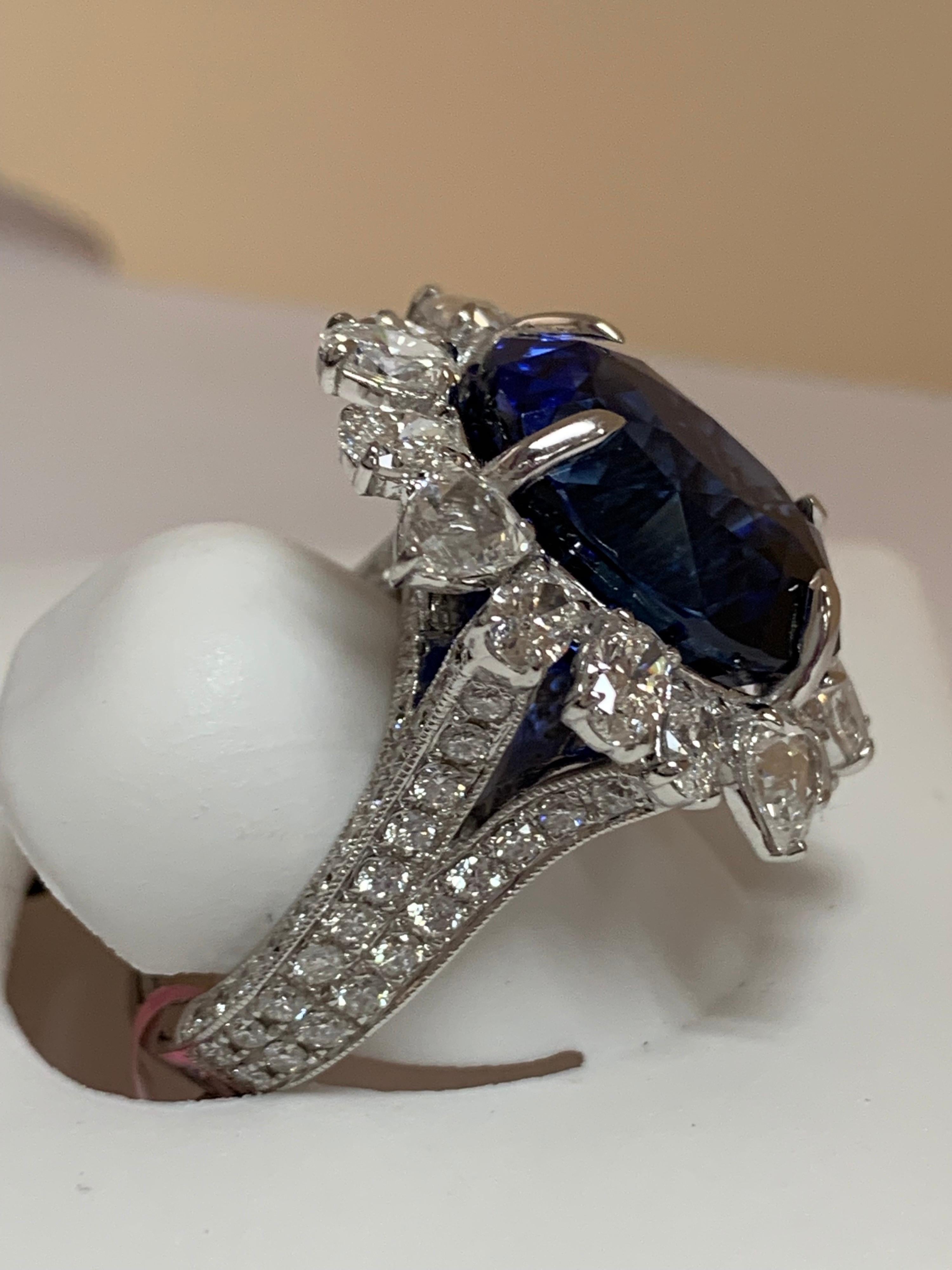 Natural 20.08 Carat GIA Certified Royal Blue Sapphire and 5.05 Carat white diamond set in 18 Karat white gold, The ring is one of a kind handcrafted.