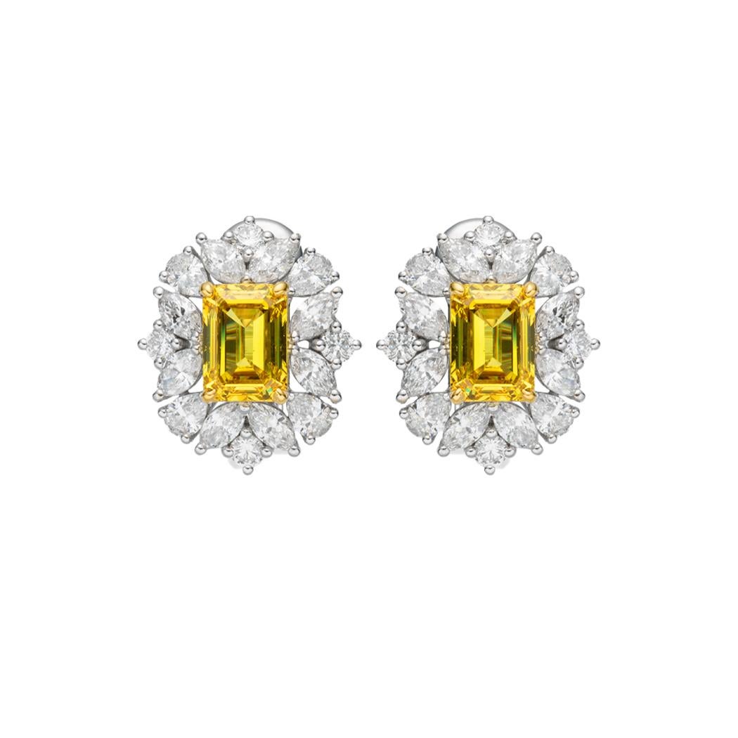 Enhance your jewelry collection with a touch of opulence and a burst of color that will leave onlookers in awe. These remarkable 1.00ct Fancy Vivid Yellow GIA certified natural diamond earrings are a true testament to exquisite craftsmanship and