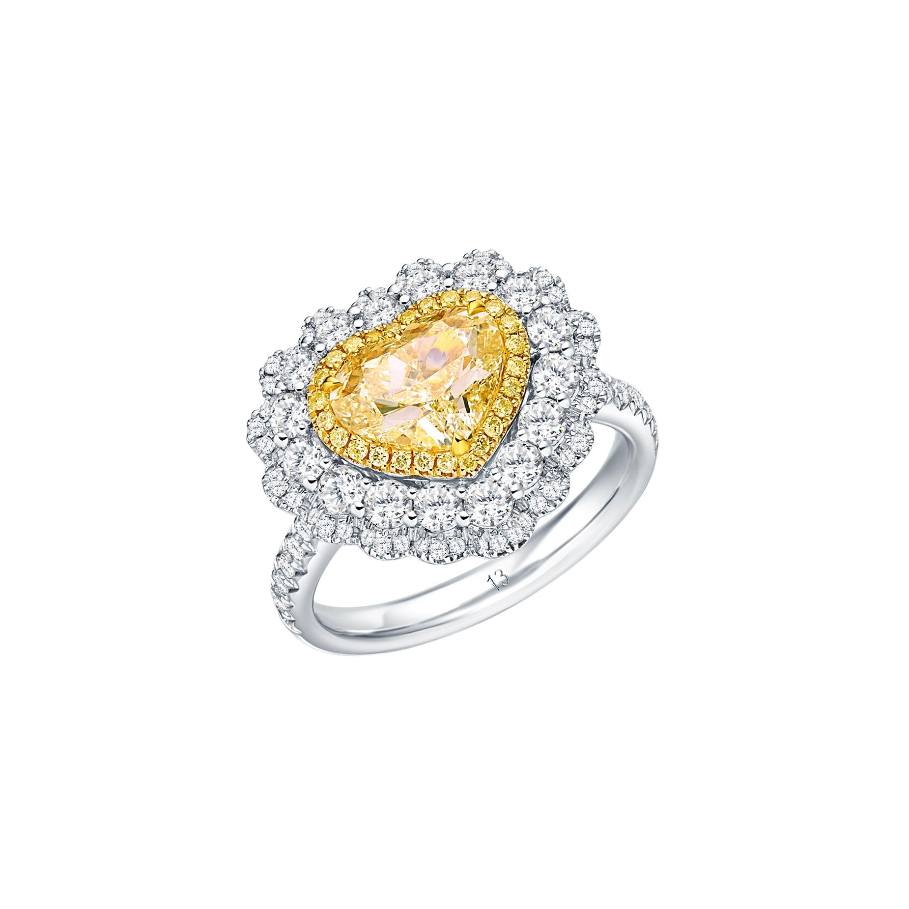 Experience the ultimate expression of elegance and love with this enchanting GIA Certified 2.00 carat Natural Heart Shape U to V Range Diamond Solitaire Ring. Set upon a resplendent 18kt gold band, this exquisite piece encapsulates the timeless