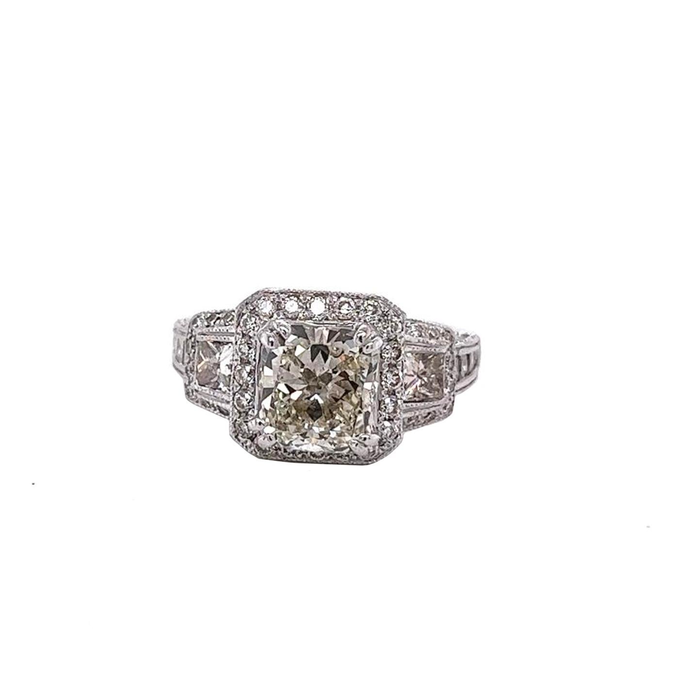 This beautiful Cushion Diamond Ring Magnificently Features a 2.01 Carat Cushion Modified Brilliant Cut with Pave Diamonds Engagement Ring crafted in 14K Gold with dimensions of 7.84 x 7.29 x 4.54mm. It has a Cushion cut Main Stone with Pave