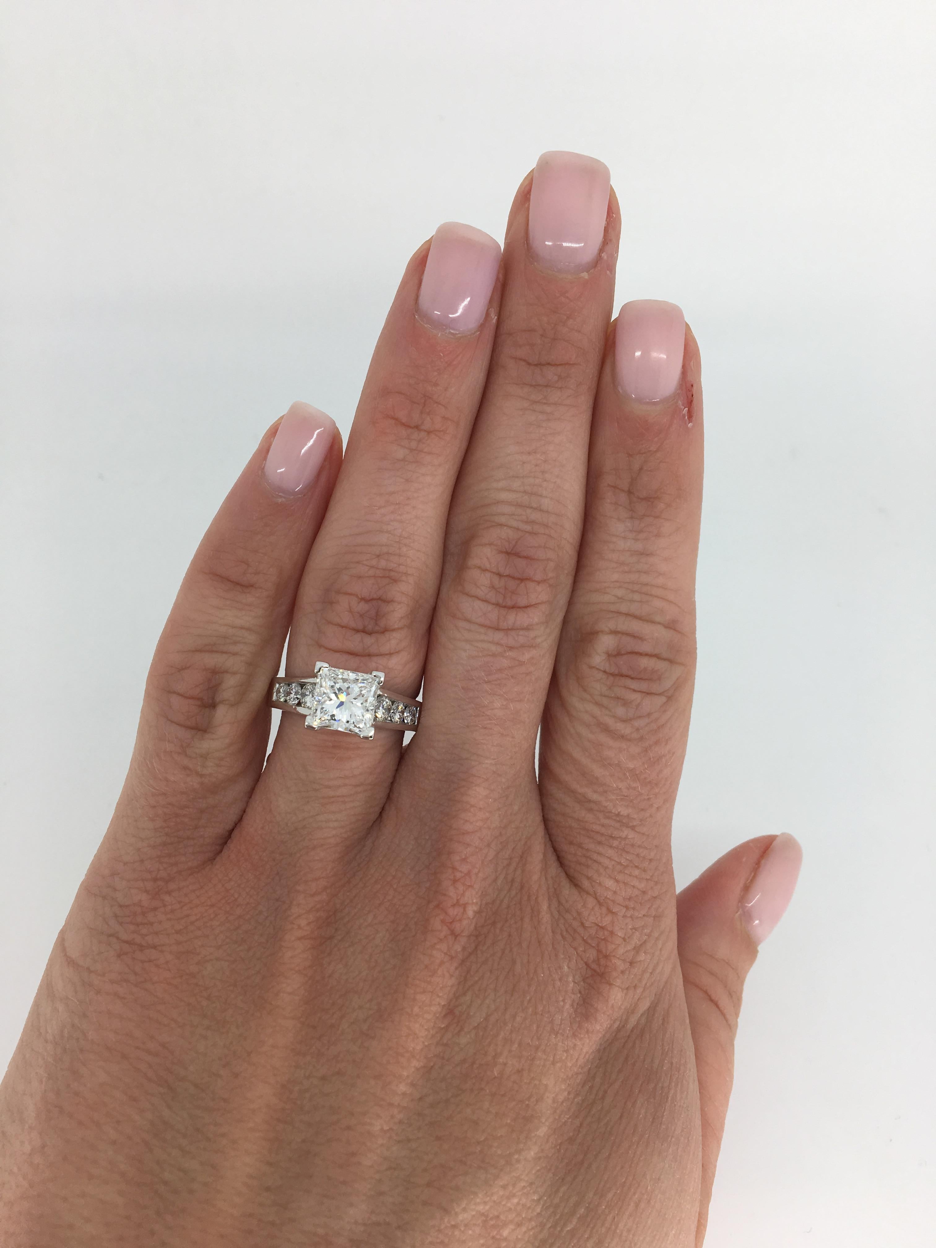 This classic engagement ring features a GIA Certified 2.01CT Princess Cut Diamond with 6 round brilliant cut diamonds accenting it.

GIA Certified, Electronic Copy Only, and GIA verification report Diamond is laser Scribed- GIA 12323650
 
Center