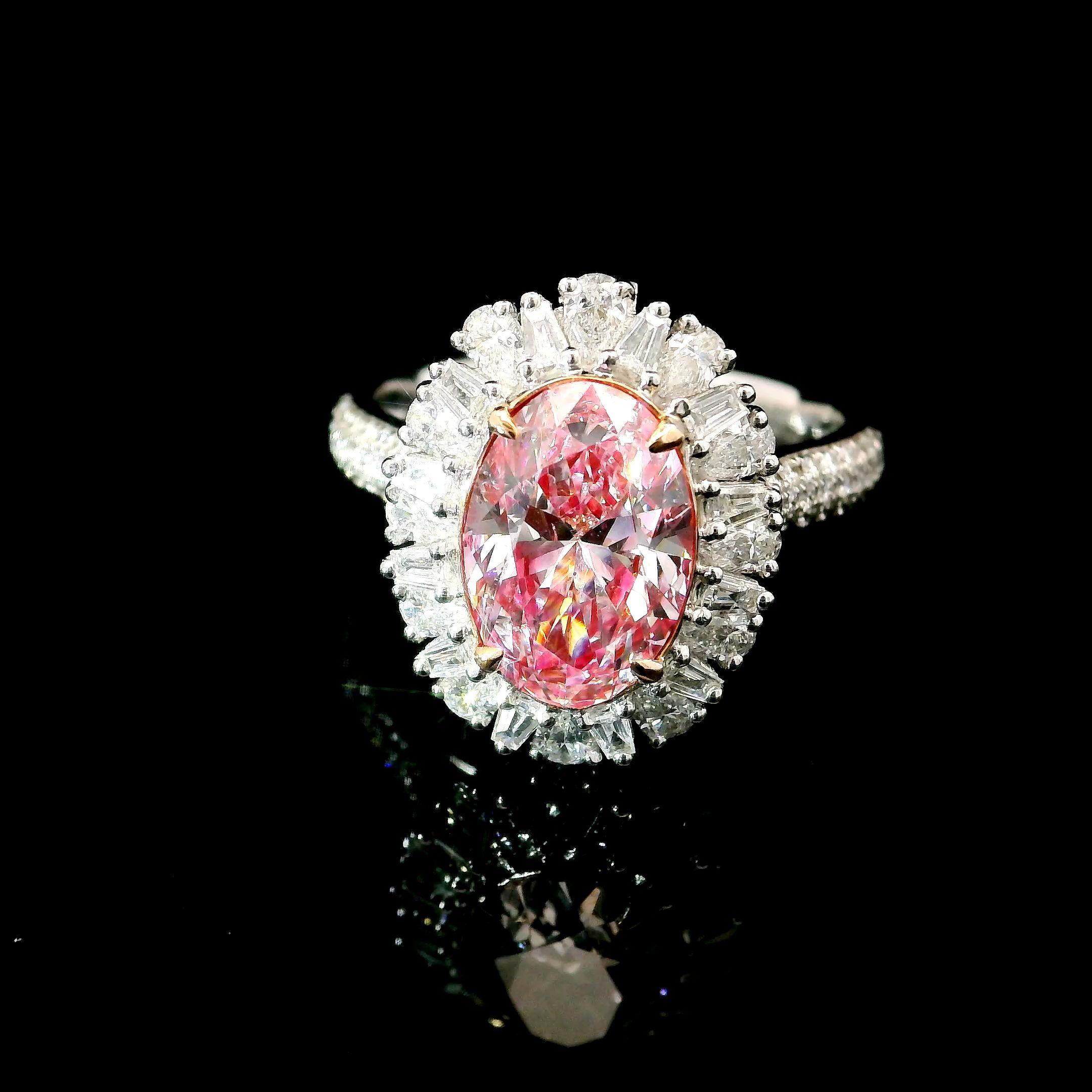 18kt white gold ring with diamonds
  
  Gold colour & karat: White gold 18kt
  Weight: 5.56 grams
  
  Set with-
  Stone type: Diamonds
  Shape: Oval
  Carat: 2.01 ct
  Colour: Faint Pink
  Clarity: SI2
  
  Surrounding Stones: Diamonds
 1) White