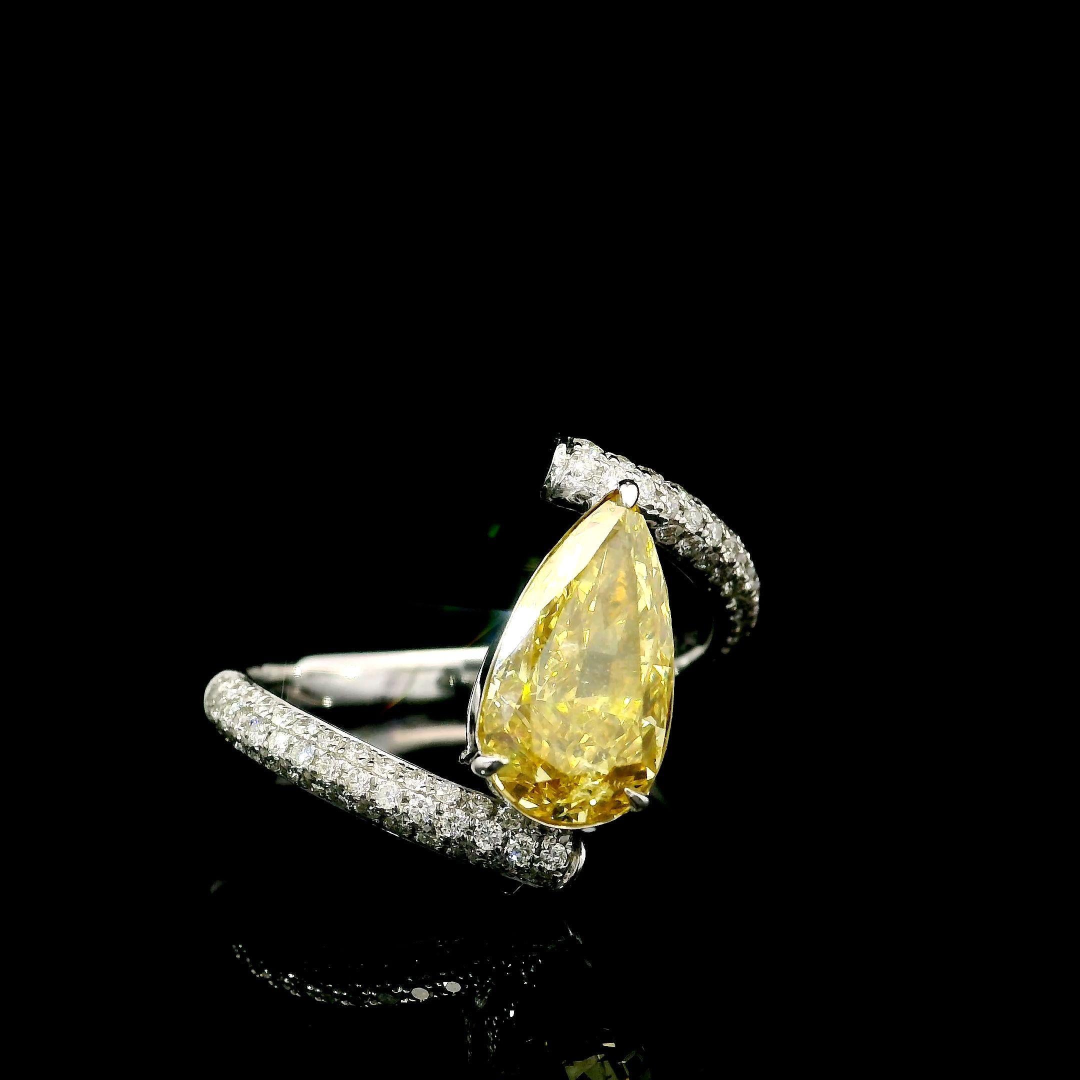 18kt white gold ring with diamonds
  
  Gold colour & karat: White gold 18kt
  Weight: 3.252 grams
  
  Set with-
  Stone type: Diamonds
  Shape: Pear
  Carat: 2.01
  Colour: Fancy Intense Yellow
  Clarity: I1
  
  Surrounding Stones: Diamonds
 1)