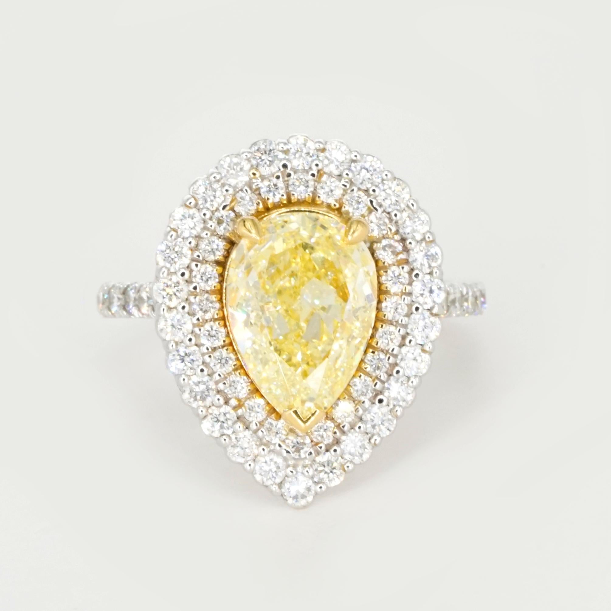 18K Yellow and White Gold 2.01 Carat Fancy Light Yellow Diamond Double Halo Ring

This stunning ring features a breathtaking 2.01 carat Fancy Light Yellow Diamond at its center, certified by GIA. The diamond, expertly cut in a Pear Modified
