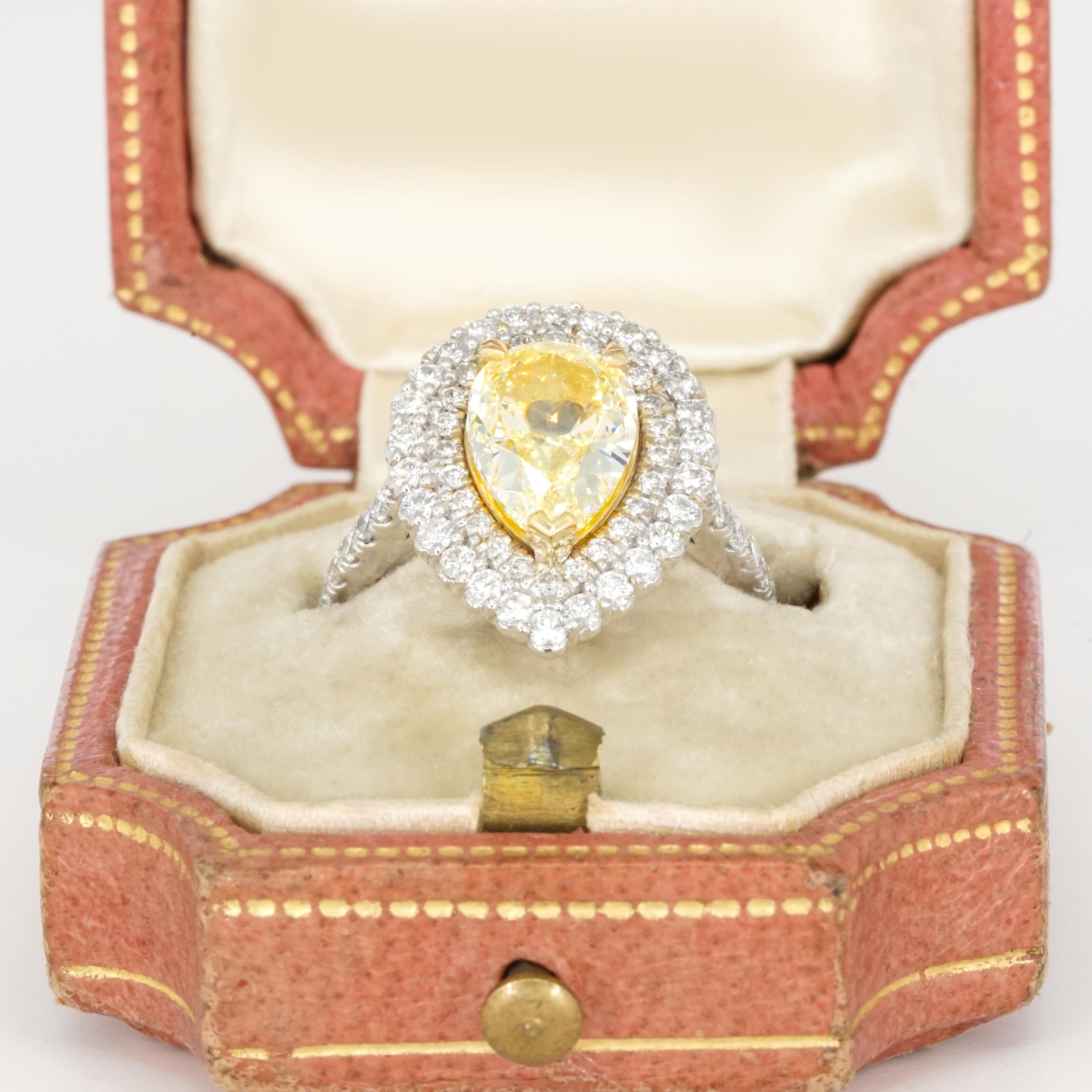Pear Cut GIA Certified 2.01 Carat Fancy Light Yellow Diamond 18K Gold Double Halo Ring For Sale
