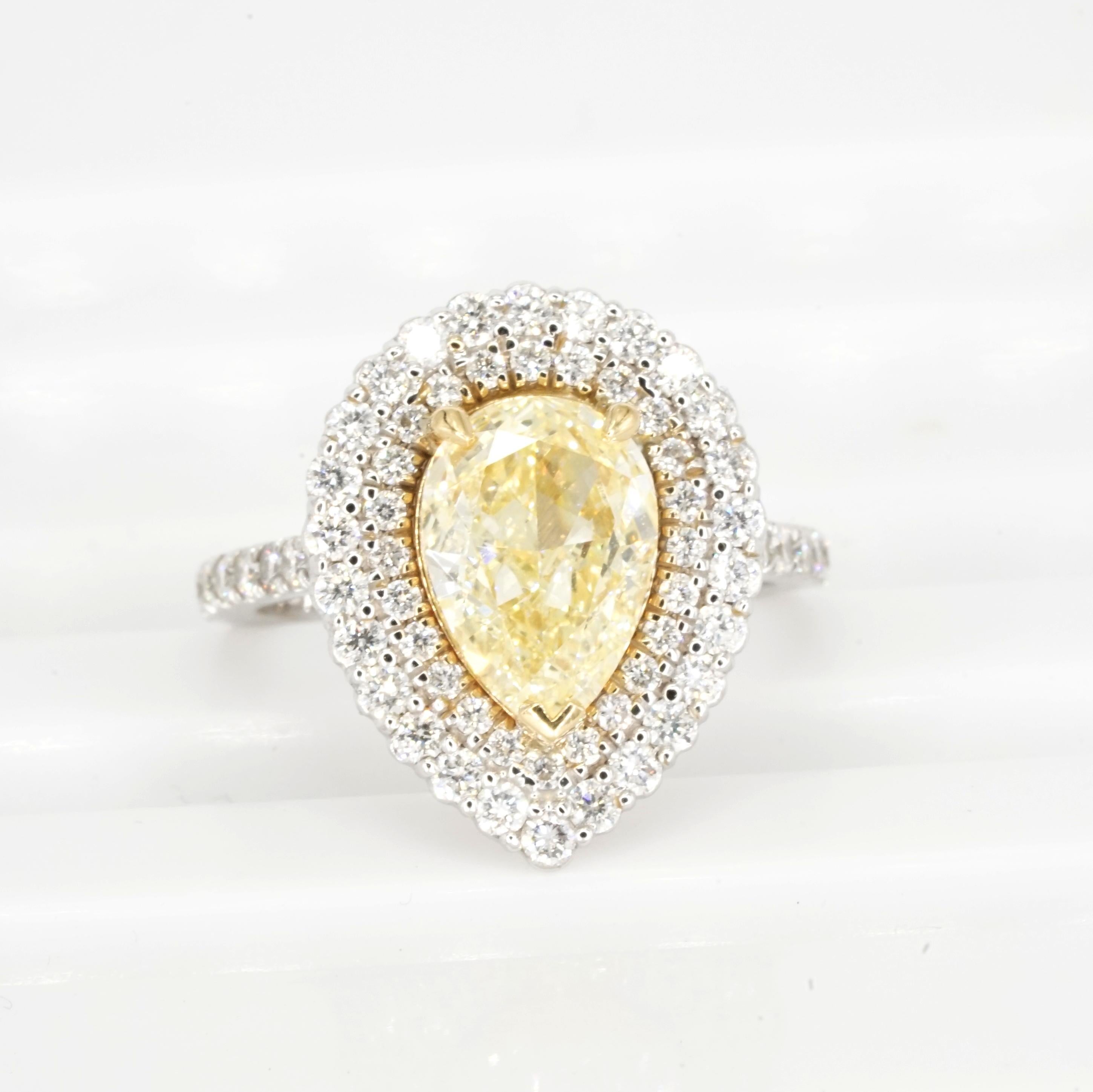 GIA Certified 2.01 Carat Fancy Light Yellow Diamond 18K Gold Double Halo Ring In New Condition For Sale In Chicago, IL