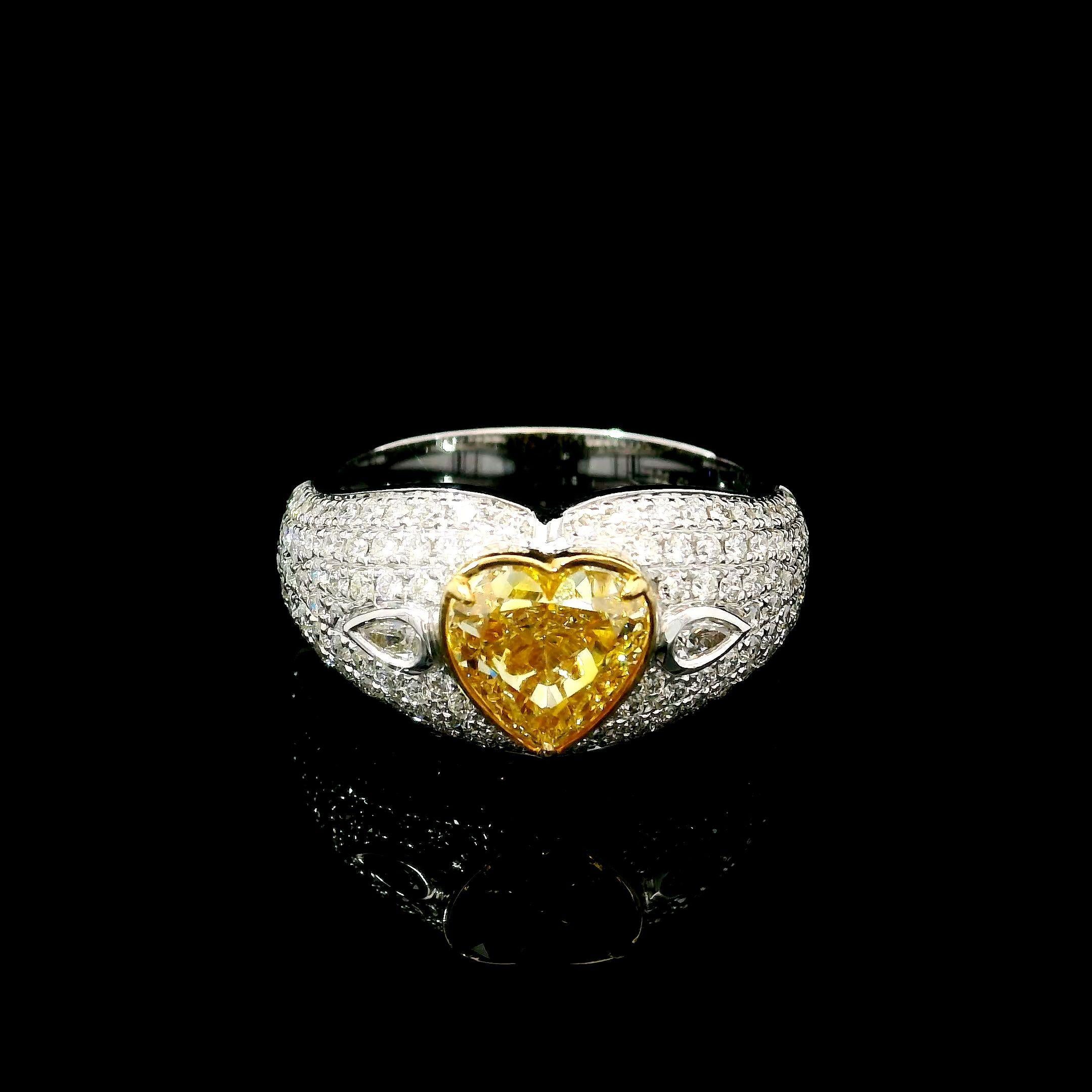 18kt white gold ring with diamonds
  
  Gold colour & karat: White gold 18kt
  Weight: 7.09 grams
  
  Set with-
  Stone type: Diamonds
  Shape: Heart
  Carat: 2.01 ct
  Colour: Fancy Light Yellow
  Clarity: VS1
  
  Surrounding Stones: Diamonds
 1)