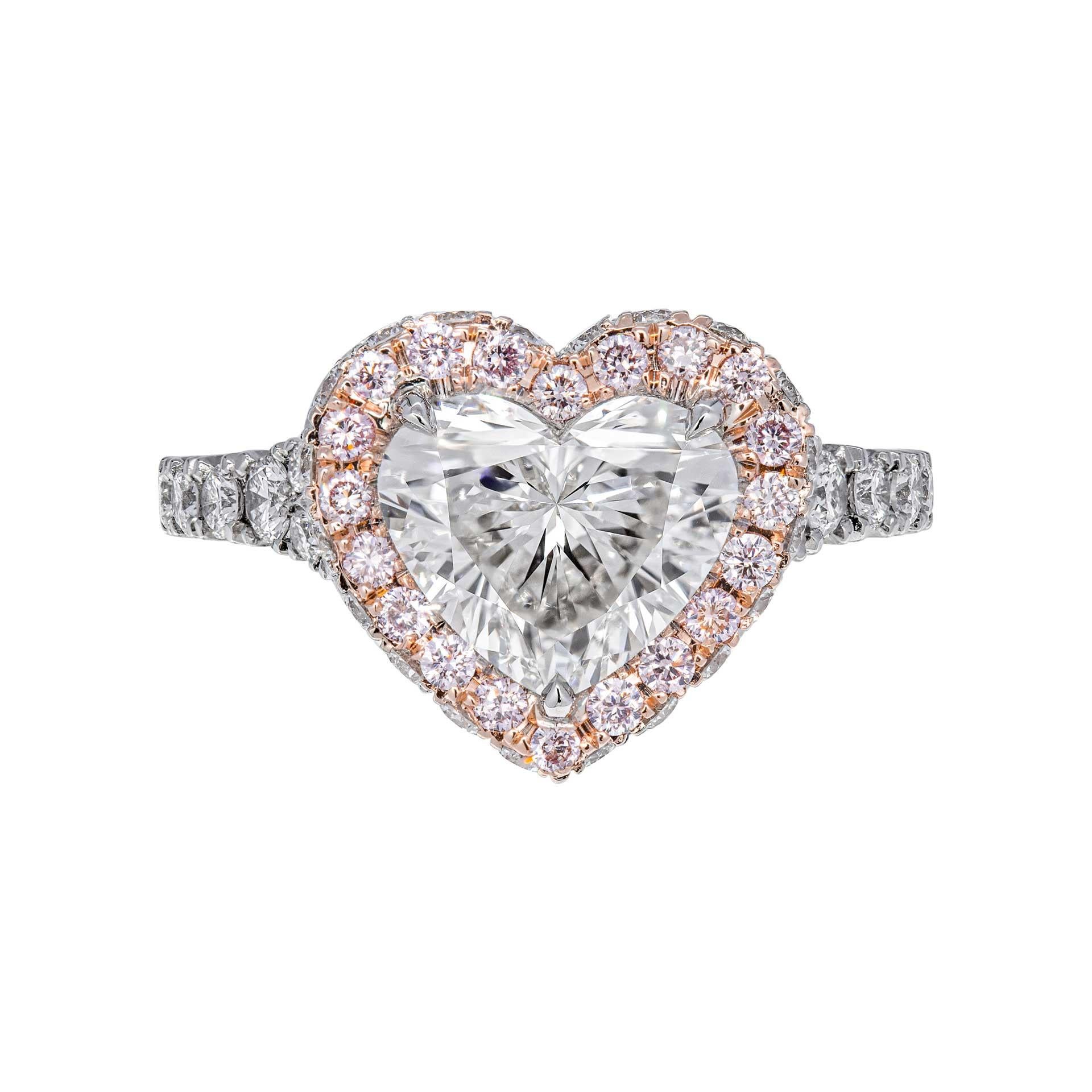 Trendy yet Timeless Heart ShapevDiamond Engagement -  classic with a modern spin
Mounted in Platinum and 18K Rose Gold, featuring exceptional pave work that compliments the center stone,
Mounting features halo with natural pink diamonds around