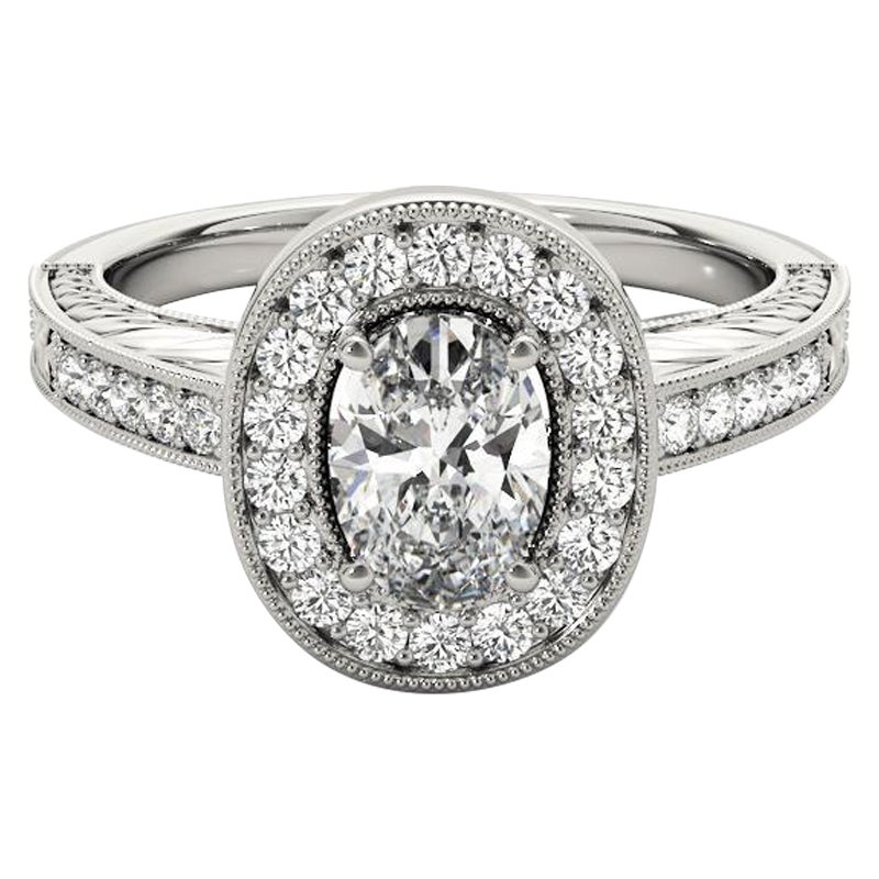 Anello con diamante ovale aureolato inciso e traforato certificato GIA da 2.01 carati