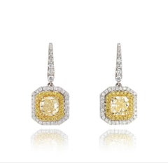 A Pair of GIA Certified 2.01 Carat Pair of Fancy Yellow Diamond Drop Earrings