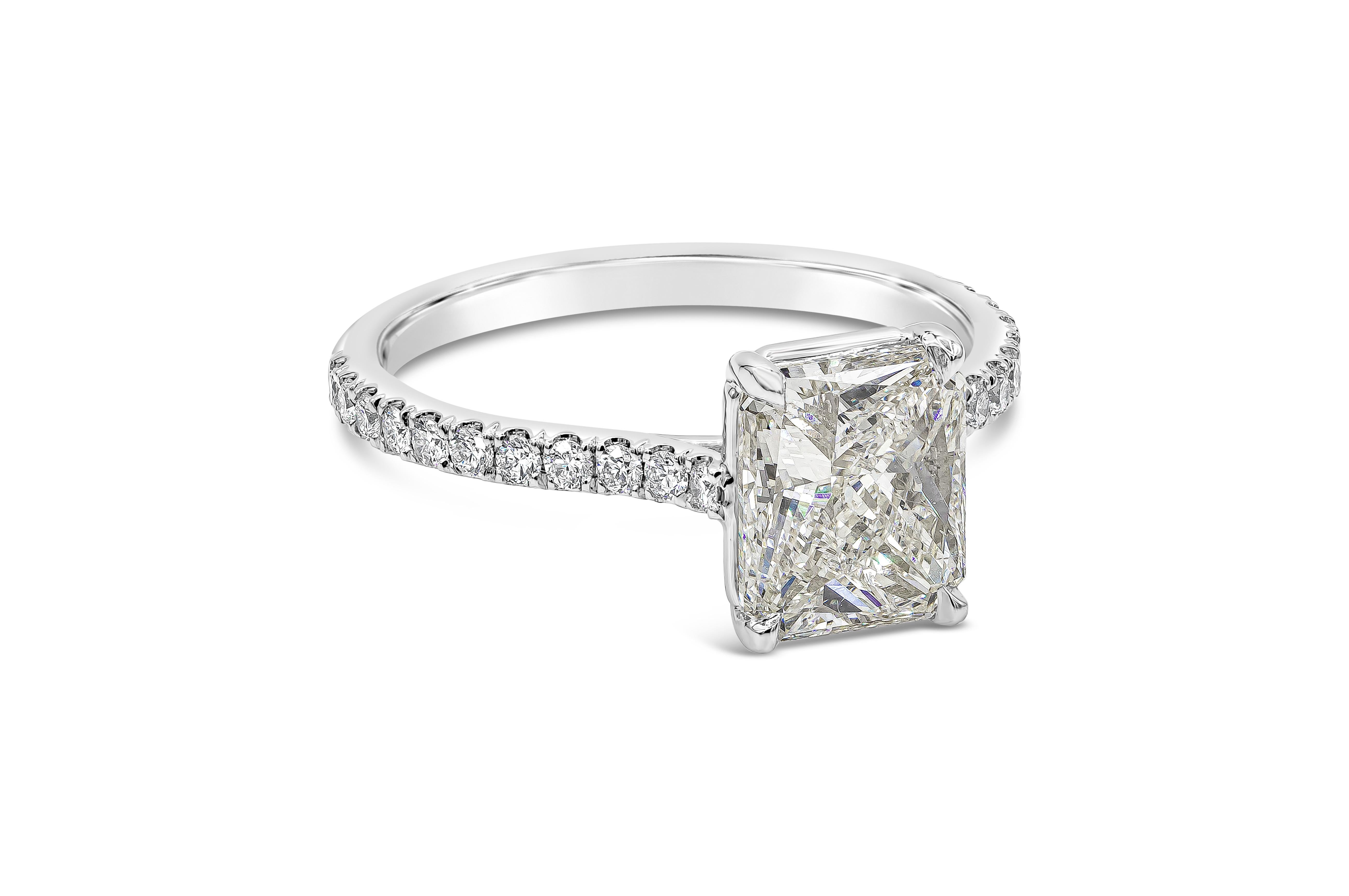 A classic engagement ring style showcasing a 2.01 carat radiant cut diamond certified by GIA as K color, SI1 clarity. Center diamond set in a platinum band accented with round diamonds weighing 0.30 carats total. Size 6.25

Style available in