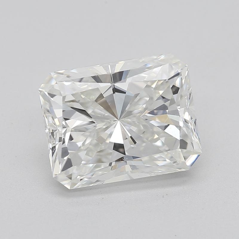 Handcrafted in New York, this exquisite diamond ring is a remarkable testament to elegance and craftsmanship, featuring a breathtaking radiant H VS2 2.01 center stone. Set in luxurious yellow gold , the design is a harmonious blend of classic