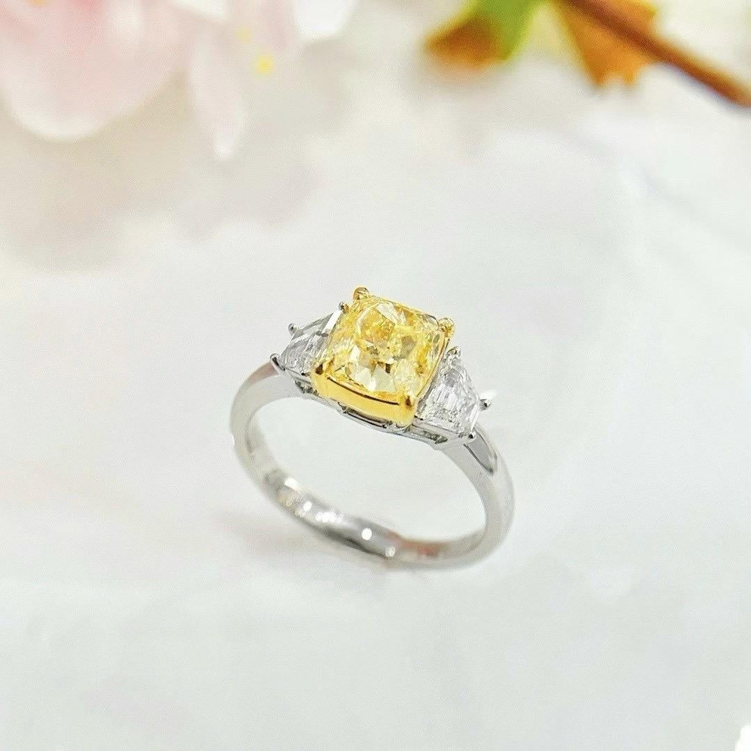 Modern GIA Certified 2.01 CT Fancy Light Yellow Diamond Three-Stone Ring For Sale