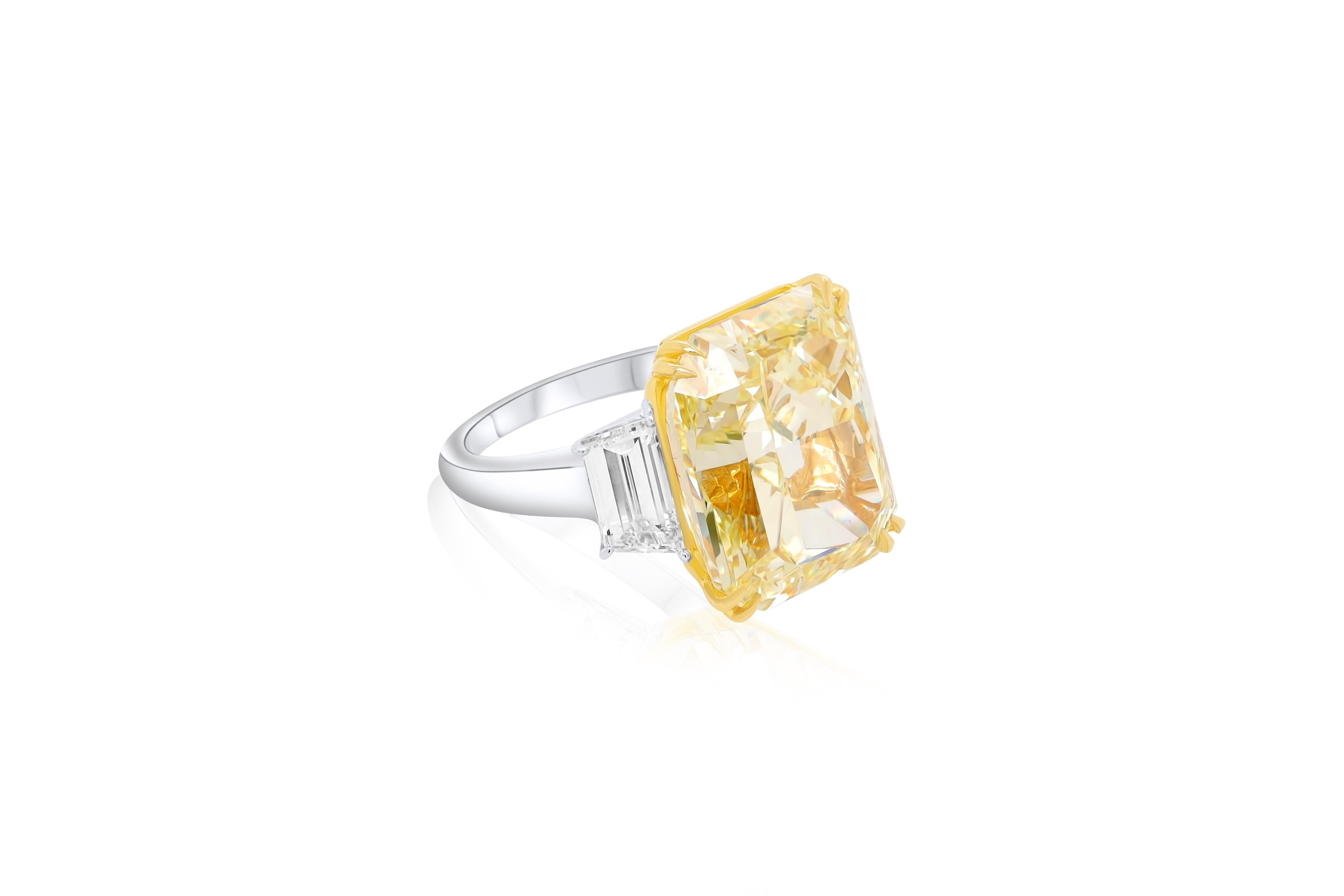 Platinum and 18 kt yellow gold engagement ring featuring a center 20.17 ct GIA certified (FIY VVS1) fancy intense yellow diamond with 2.05 cts tw of trapezoid cut diamonds on the sides (F/VS)
Diana M is one-stop shop for all your jewelry shopping,
