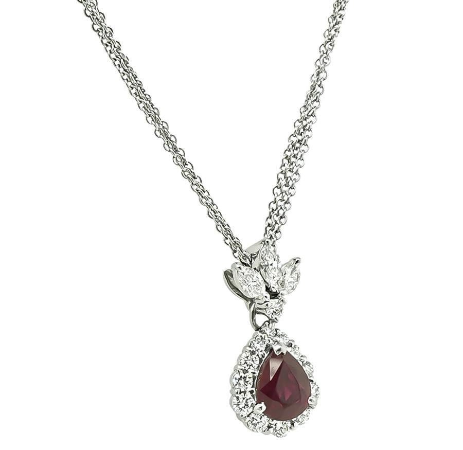 This is an elegant platinum pendant necklace. The pendant is centered with lovely GIA certified pear shape Burma ruby that weighs 2.01ct. The ruby is accentuated by sparkling marquise and round cut diamonds that weigh approximately 1.01ct. The color